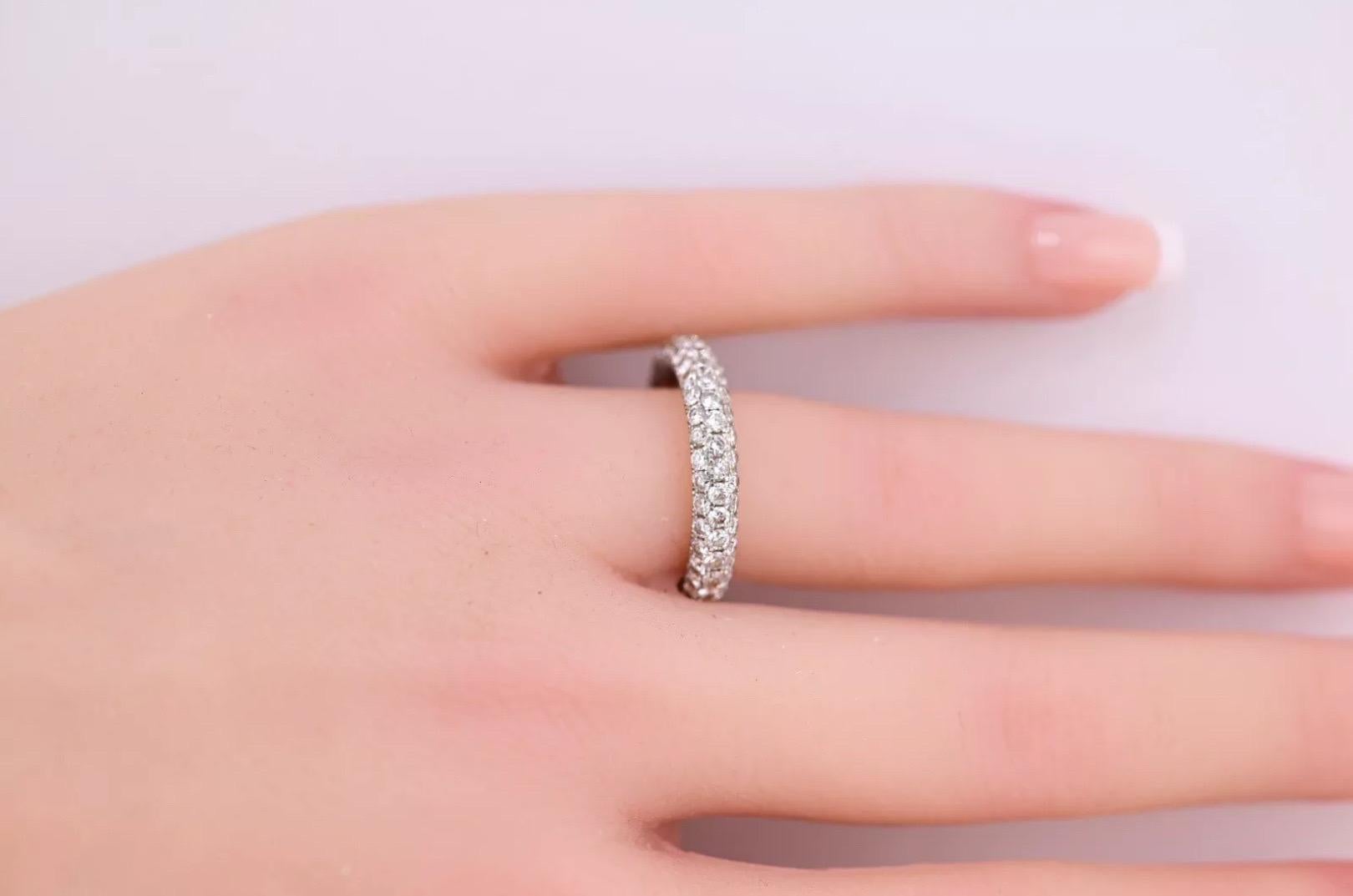 This stunning 14K white gold eternity band is the perfect addition to any jewelry collection. The band features a beautiful diamond design with 3 carats of natural diamonds that have been IGI certified. The ring size is 7.75 and the style is a band,