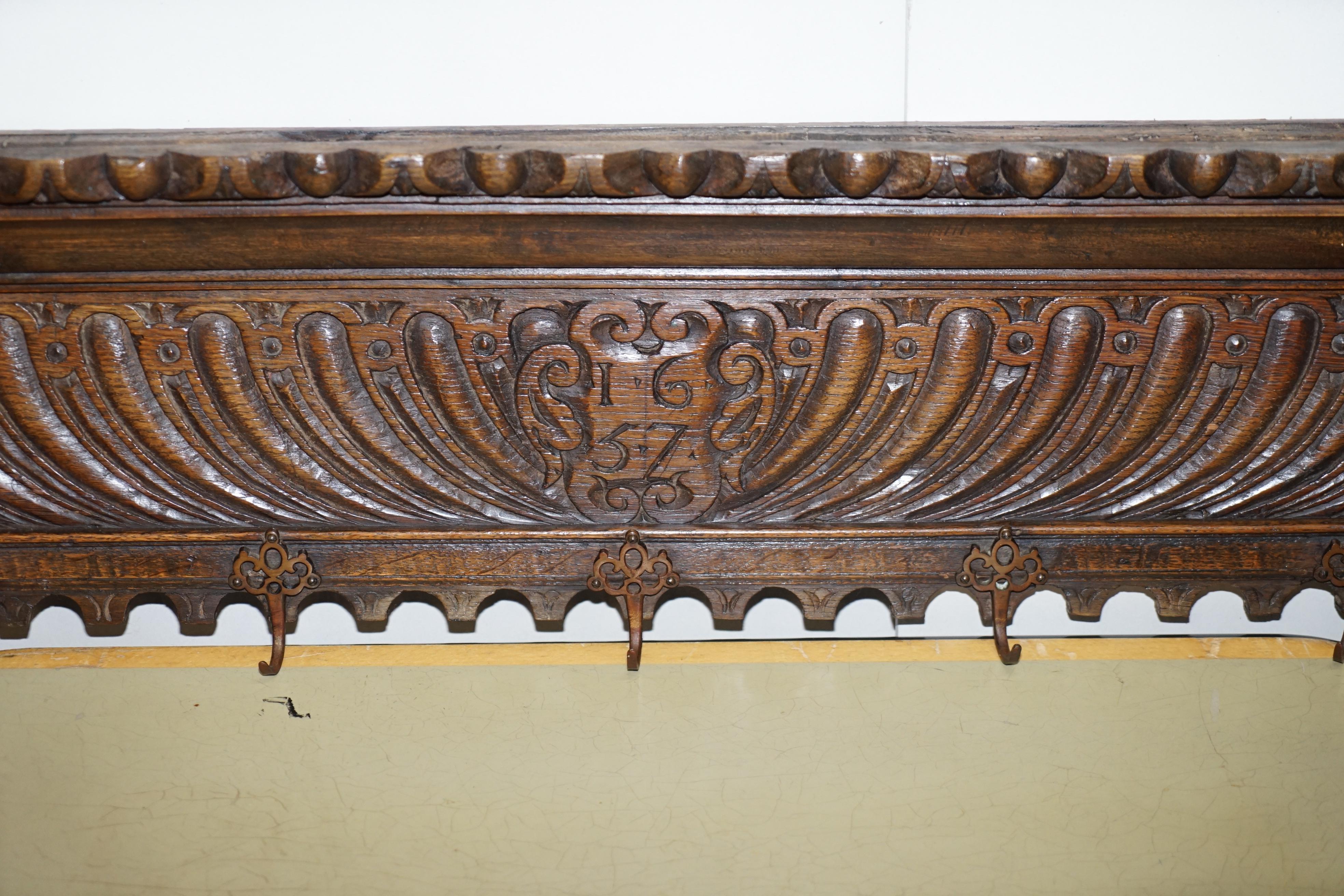 We delighted to offer for sale this lovely 1657 dated hand carved, Charles II, oak hat and coat rack

A very decorative and well made piece, carved with the date to the centre, this is either Dutch or Austrian, it was bough in Belgium but