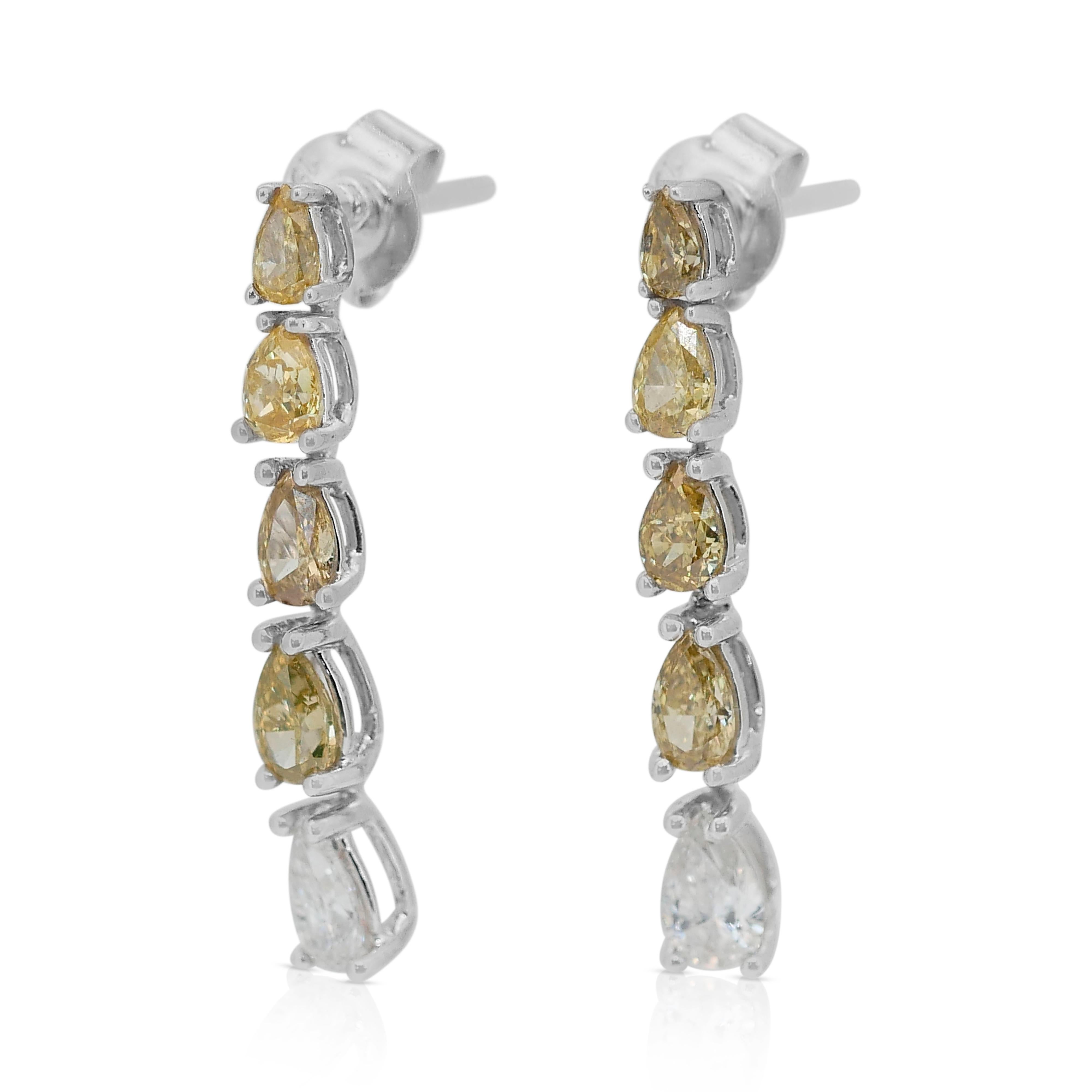 Lovely 1.82ct Diamond Fancy-Colored Drop Earrings in 18k White Gold - IGI Certified

These exquisite diamond earrings is crafted in 18k white gold, offering a timeless and elegant design. It features two pear-shaped diamonds as the main stones, with
