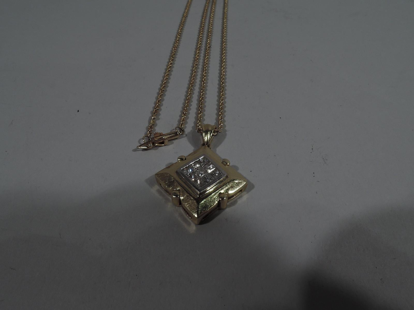 Lovely 18k gold and diamond pendant with 14k gold chain. Pendant is faceted lozenge with tubular pegs impressed on sides. Center inset with 9 square-cut diamonds (approx. total 1 carat). Back has pierced scrollwork. Rope chain. United States,