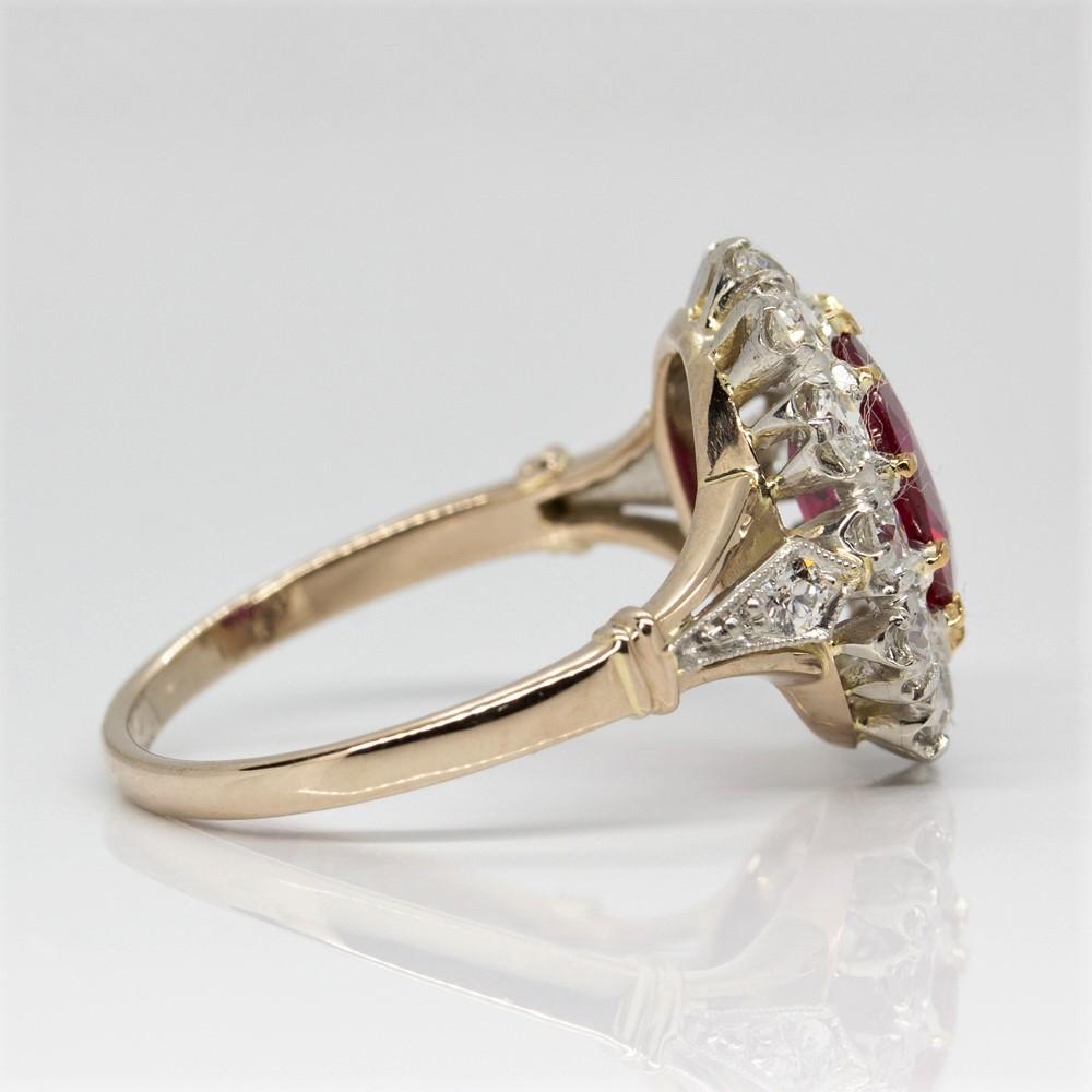 Crafted in 18k gold and platinum, this lovely item displays a central natural oval cut GIA CERTIFIED ruby that weighs 2.24ctw.
Surrounded the prominent central stone and encrusted on the sides, this ring displays 14 old mine cut diamonds of G-VS2