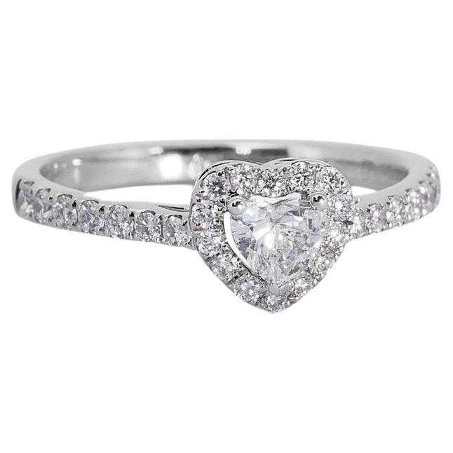 Lovely 18k White Gold Natural Diamond Halo Ring w/1.01 ct - GIA Certified

This captivating halo ring showcases a timeless design, introducing a stunning 0.71 carat heart-shaped diamond as its centerpiece. With a sparkling 28 round diamonds totaling