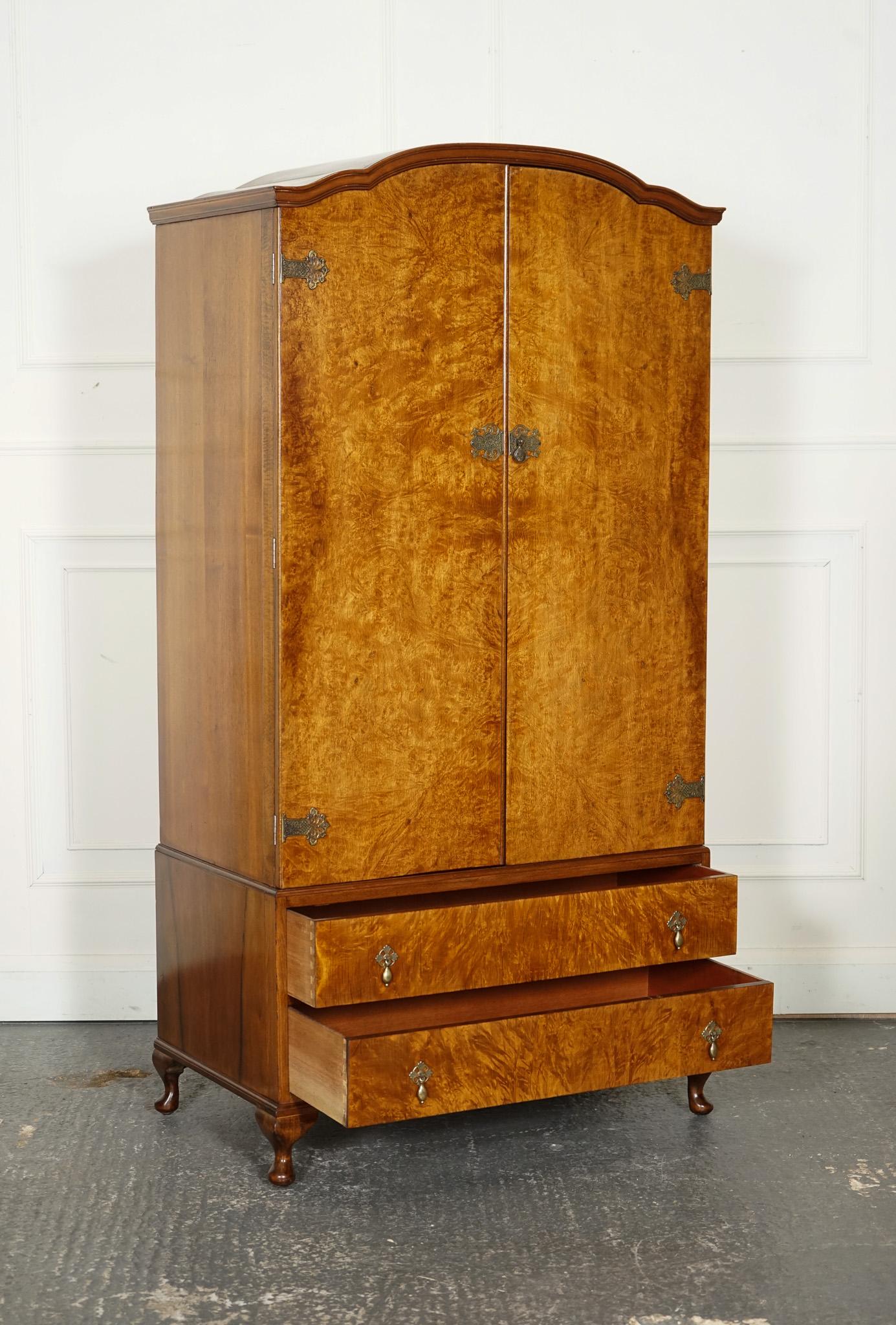 
We are delighted to offer for sale This Exquisite 1920s Art Deco Wardrobe.

 The wardrobe showcases the elegant design and craftsmanship of the era. Made from stunning burr walnut, its rich, warm tones are beautifully highlighted by the unique