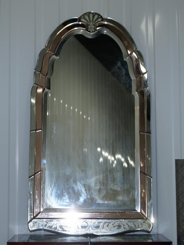 We are delighted to offer for sale this stunning and exceptionally rare circa 1930s Art Deco peach glass French Venetian etched mirror with bevelled edge frame 

A very good looking well made and decorative wall mirror, these are highly
