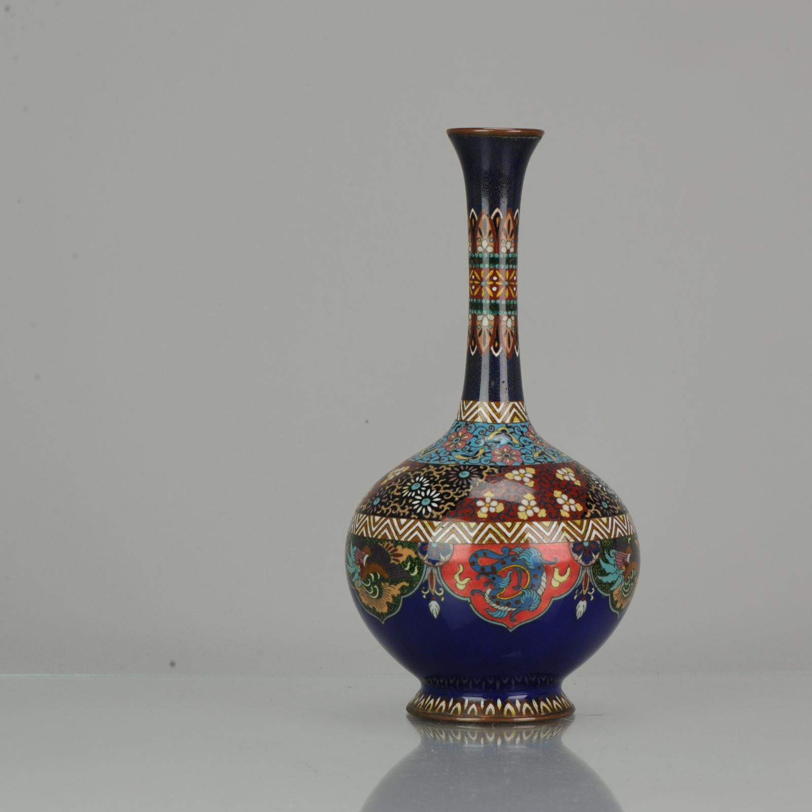 Lovely and beautifully made piece. With a stunning scene of a Phoenixes and Dragons.

Cloisonné is a way of enamelling an object, (typically made of copper) whereby fine wires are used to delineate the decorative areas (cloisons in French, hence
