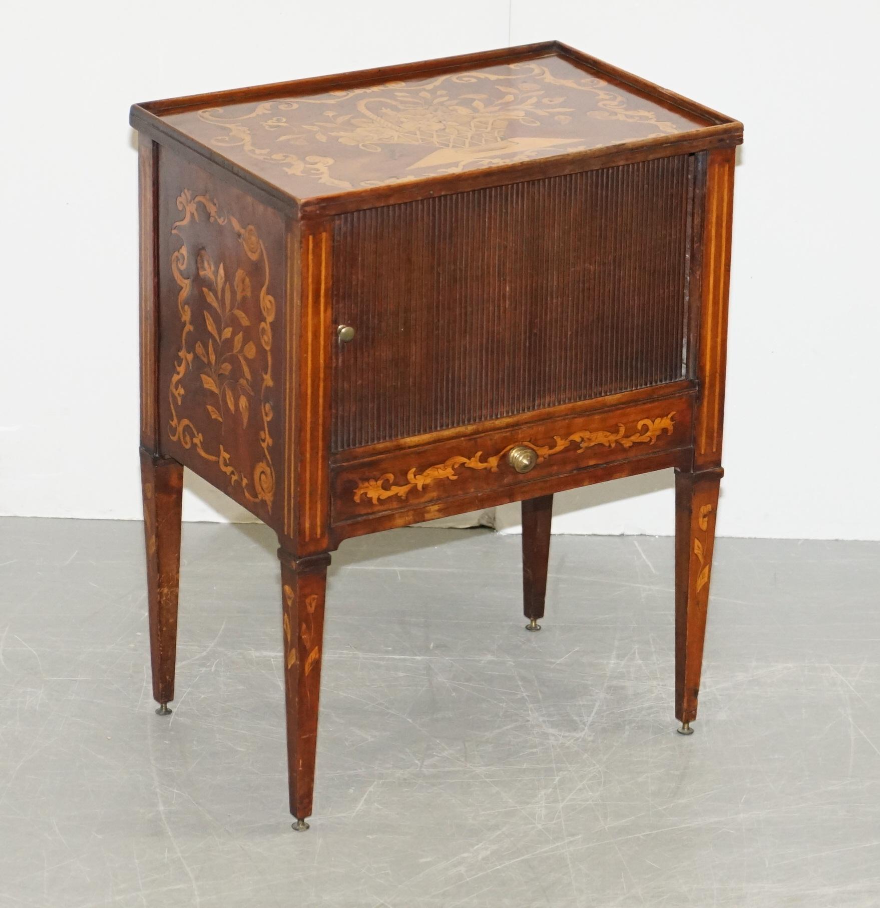 We are delighted to offer for sale this very rare tambour fronted 19th century circa 1820 Dutch marquetry inlaid side table

A very good looking and well made piece, hard to believe its over 200 years old! The timber patina is glorious, it looks