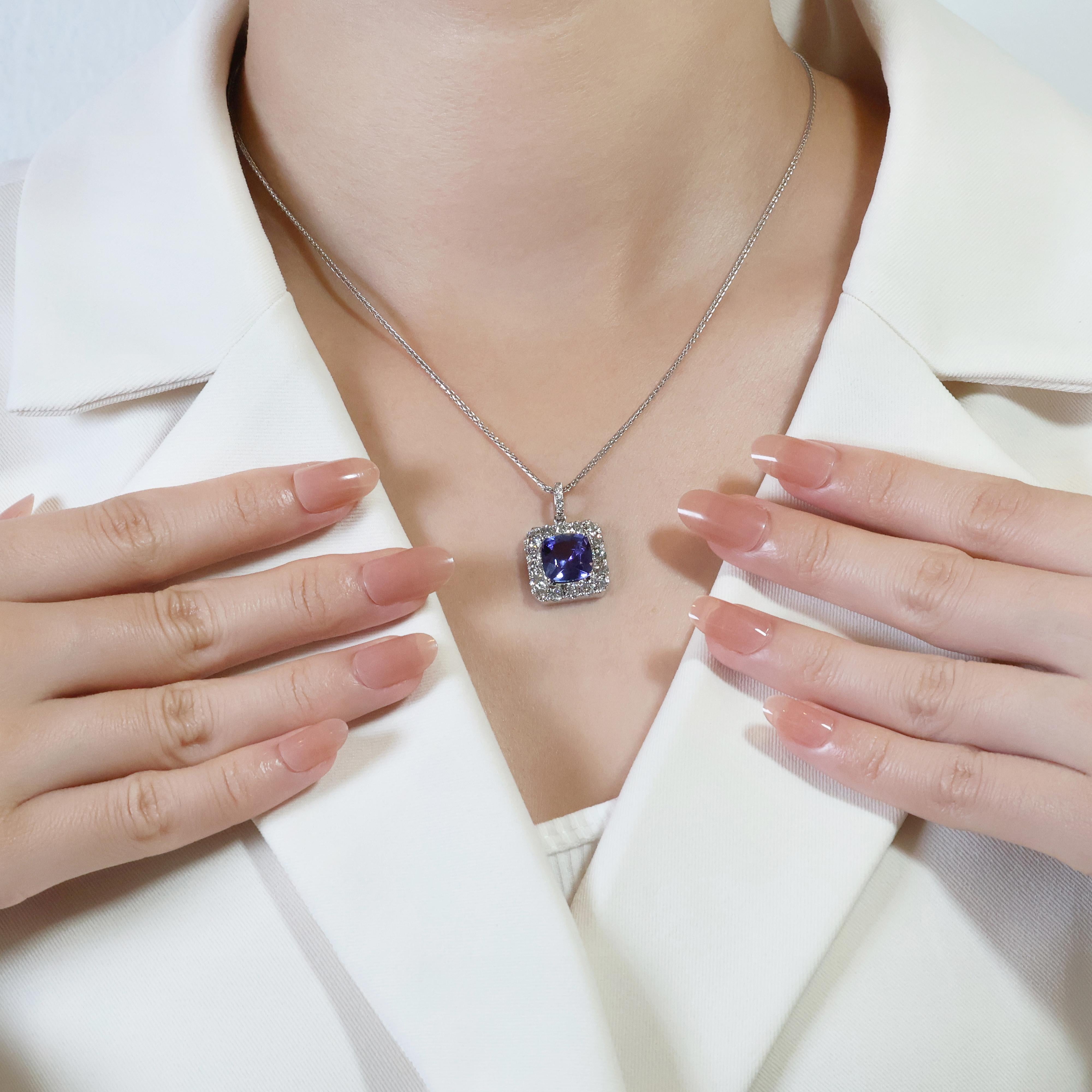 Unleash the captivating beauty of this 18k white gold pendant, a mesmerizing display of Tanzanite and diamonds. The centerpiece features a stunning 3.61-carat Tanzanite, boasting a captivating violet color and transparent clarity that showcases its