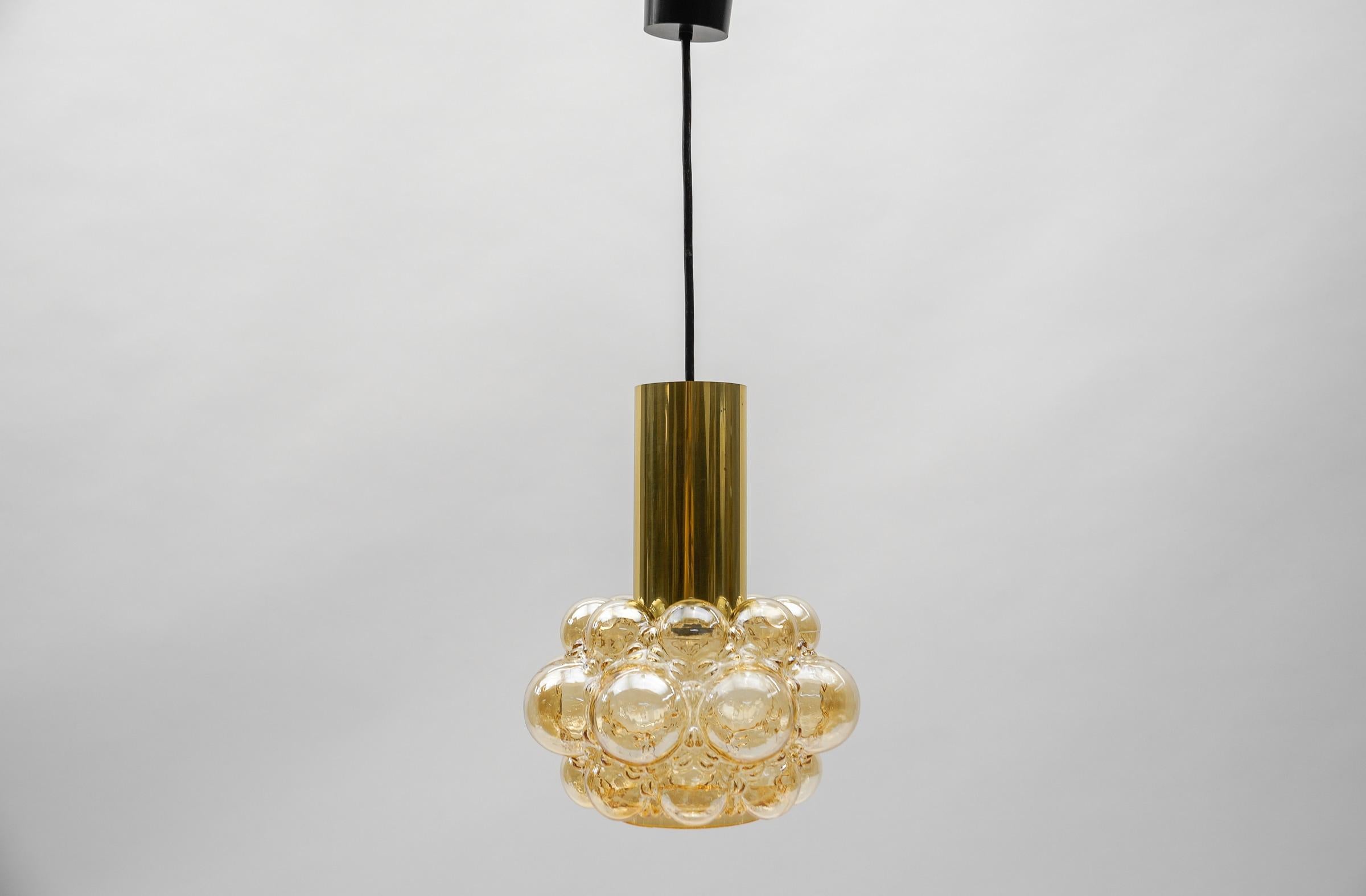 Amber Bubble Glass Ceiling Lamp by Helena Tynell for Limburg, Germany 1960s

Dimensions
Height: 23.62 in. (60 cm)
Diameter: 9.44 in. (24 cm)

The fixture need 1 x E27 standard bulb with 60W max.

Light bulbs are not included. 
It is possible to