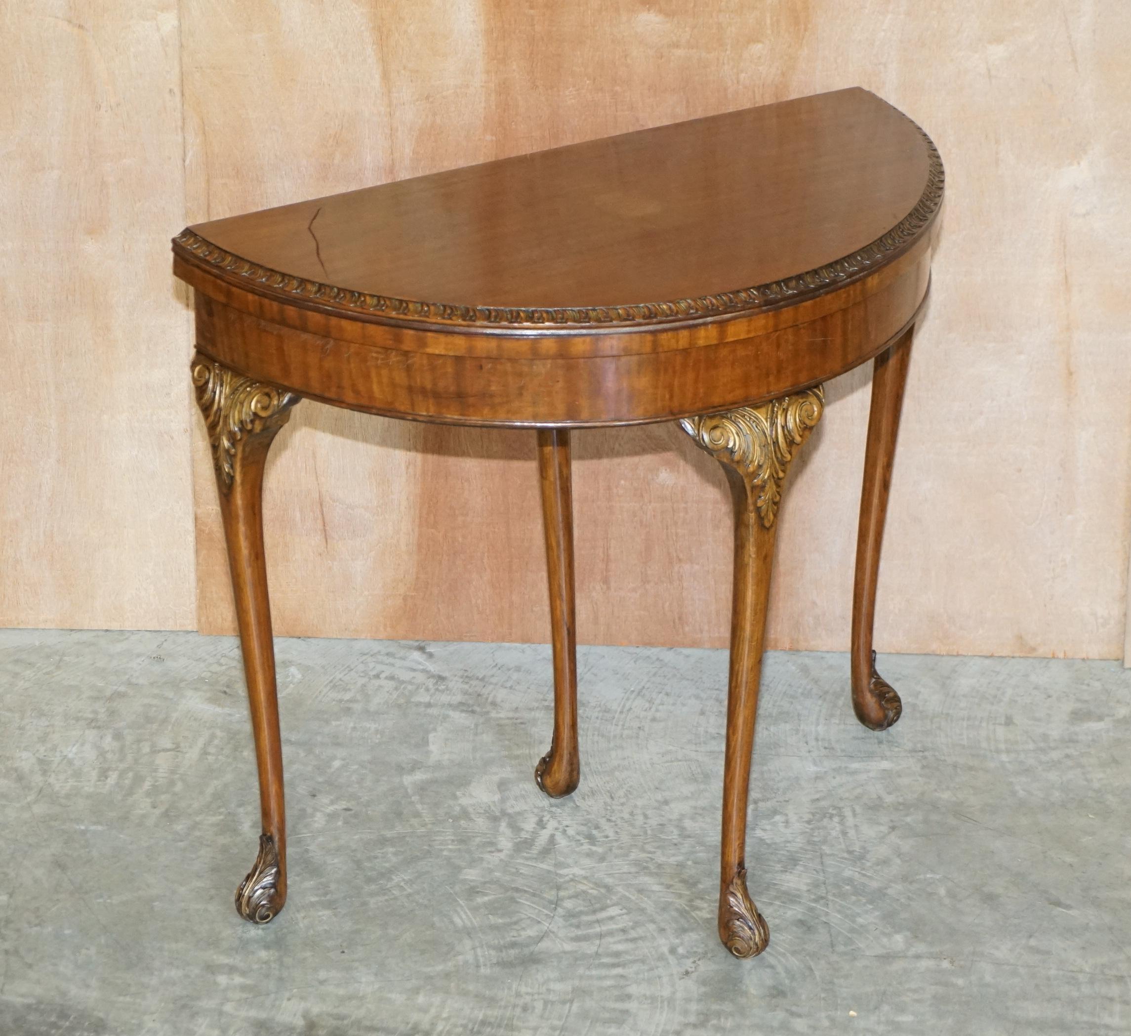 We are delighted to offer for sale this lovely circa 1880-1900 flamed mahogany demi lune games card table with ornately carved legs

A very good looking and well made piece, made in the Regency style however it is late Victorian. The legs are