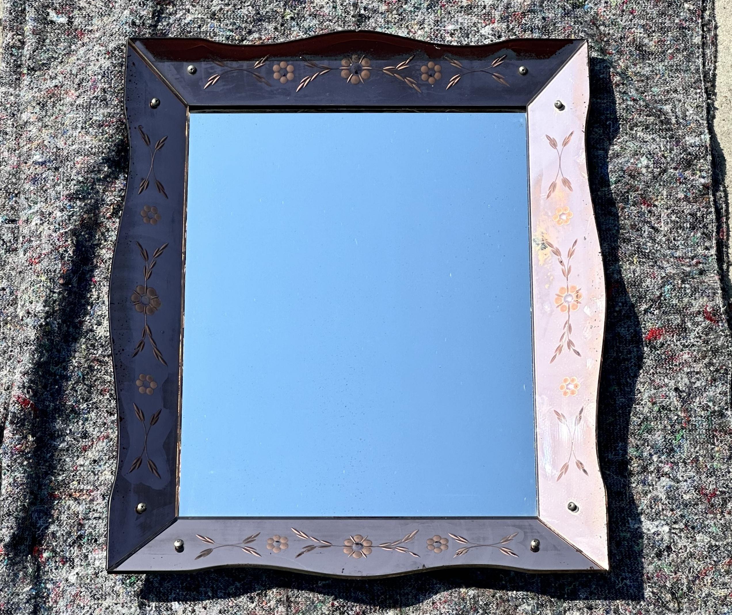 We are delighted to offer for sale absolutely sublime Rose glass Art Deco wall mirror with floral etchings.

This mirror is one of four very rare Art Deco Peach Glass mirrors I have recently acquired, in total there is a large petal framed mirror,