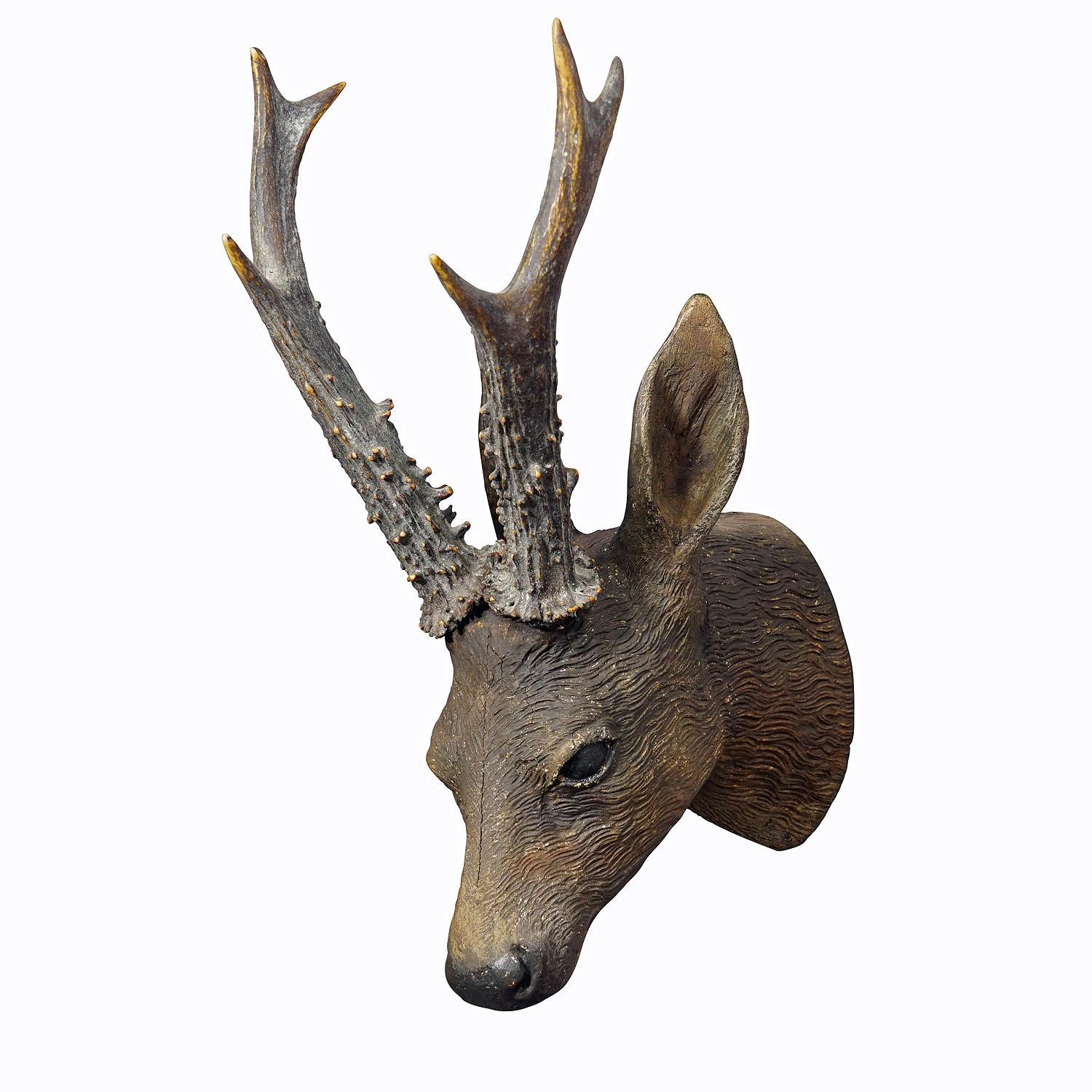 Lovely Antique Black Forest Deer Head ca. 1900s
Item e6950
A lovely wooden Black Forest deer head made of plaster and wood. Handmade in folk art style around 1900. It features a real deer horn trophy. A great individual piece which enhances every