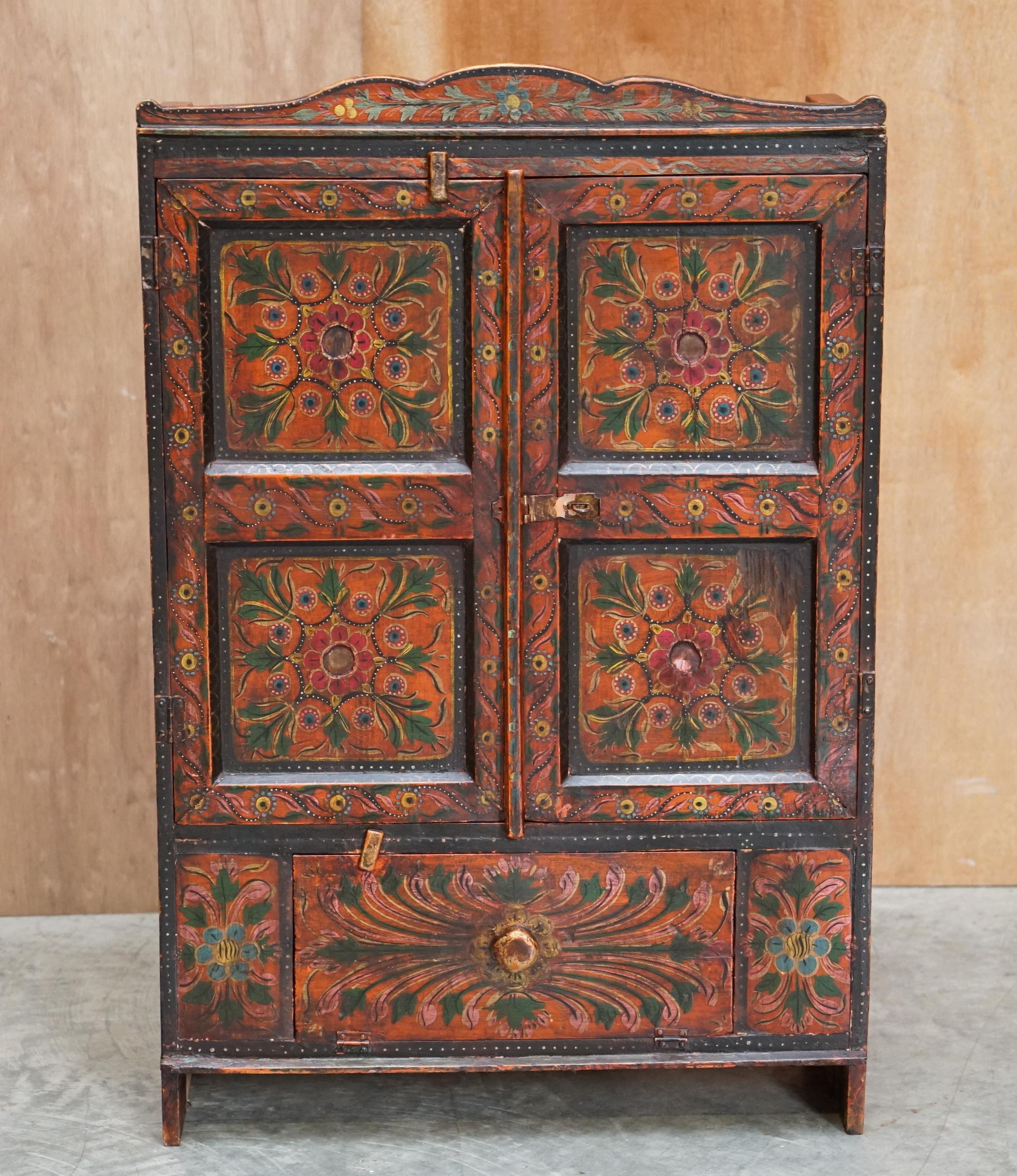 We are delighted to offer this lovely hand painted circa 1860 east European side cupboard

A good looking and well made piece, it is a great size and looks wonderful in any setting. This came from Germany but I think its Austrian, the paint ir