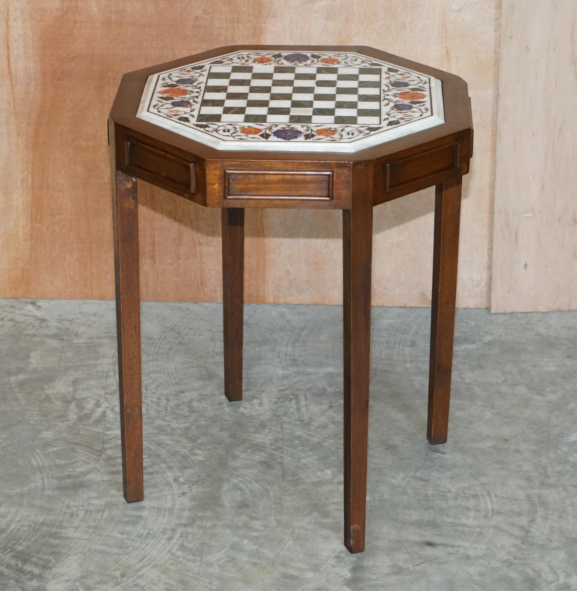 We are delighted to offer for sale this lovely antique Marble, hard stone, and mother of pearl inlaid Chess table 

A very rare find, the top is exceptionally decorative with some wonderfully colourful stones used in the form of floral motifs