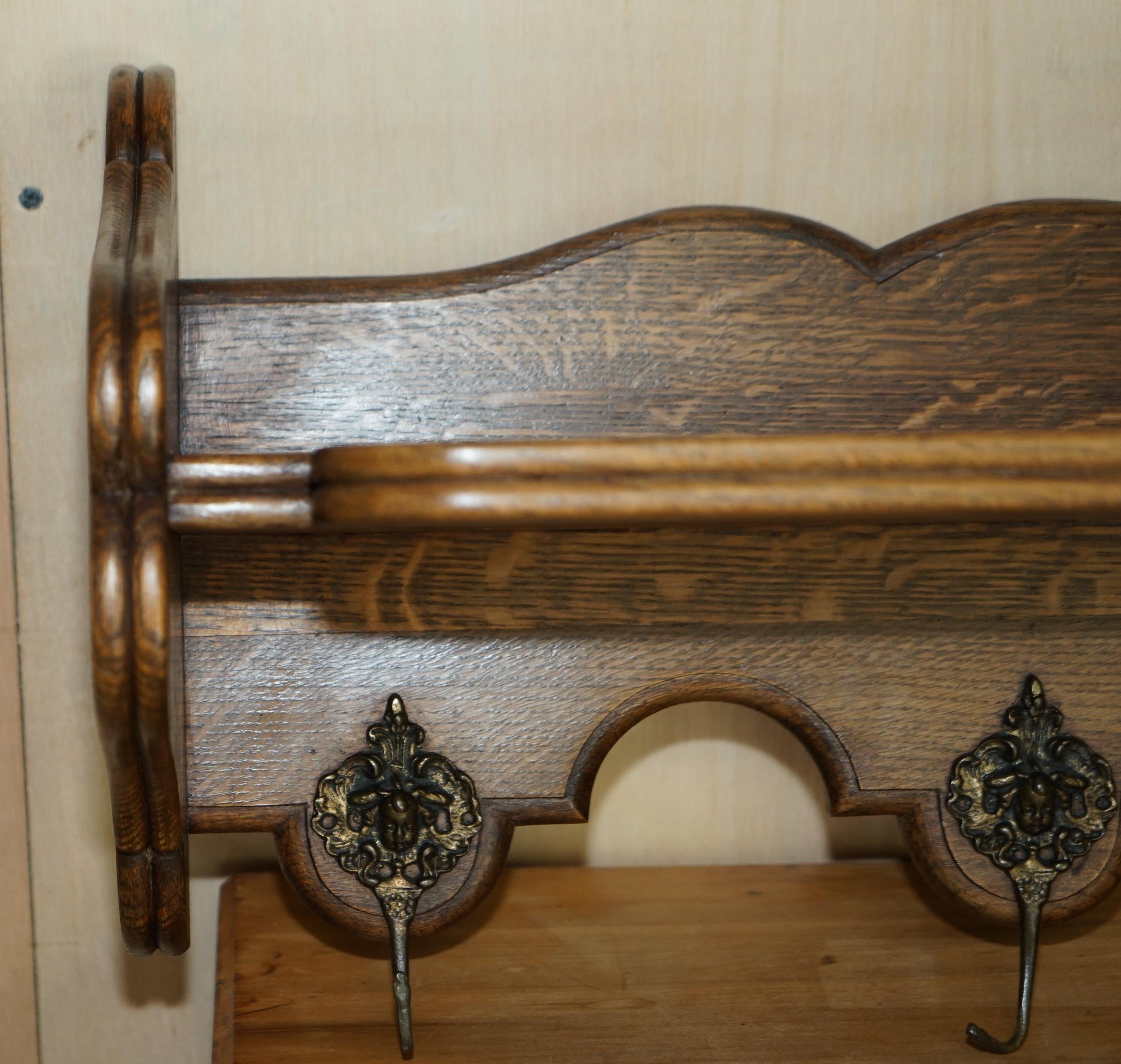 We are delighted to offer for sale this lovely, heavily carved Dutch oak wall hanging coat hat and scarf rack with French Royalty head gold gilt brass hooks

A very good looking well made and decorative coat wall rack, I have seen these used in