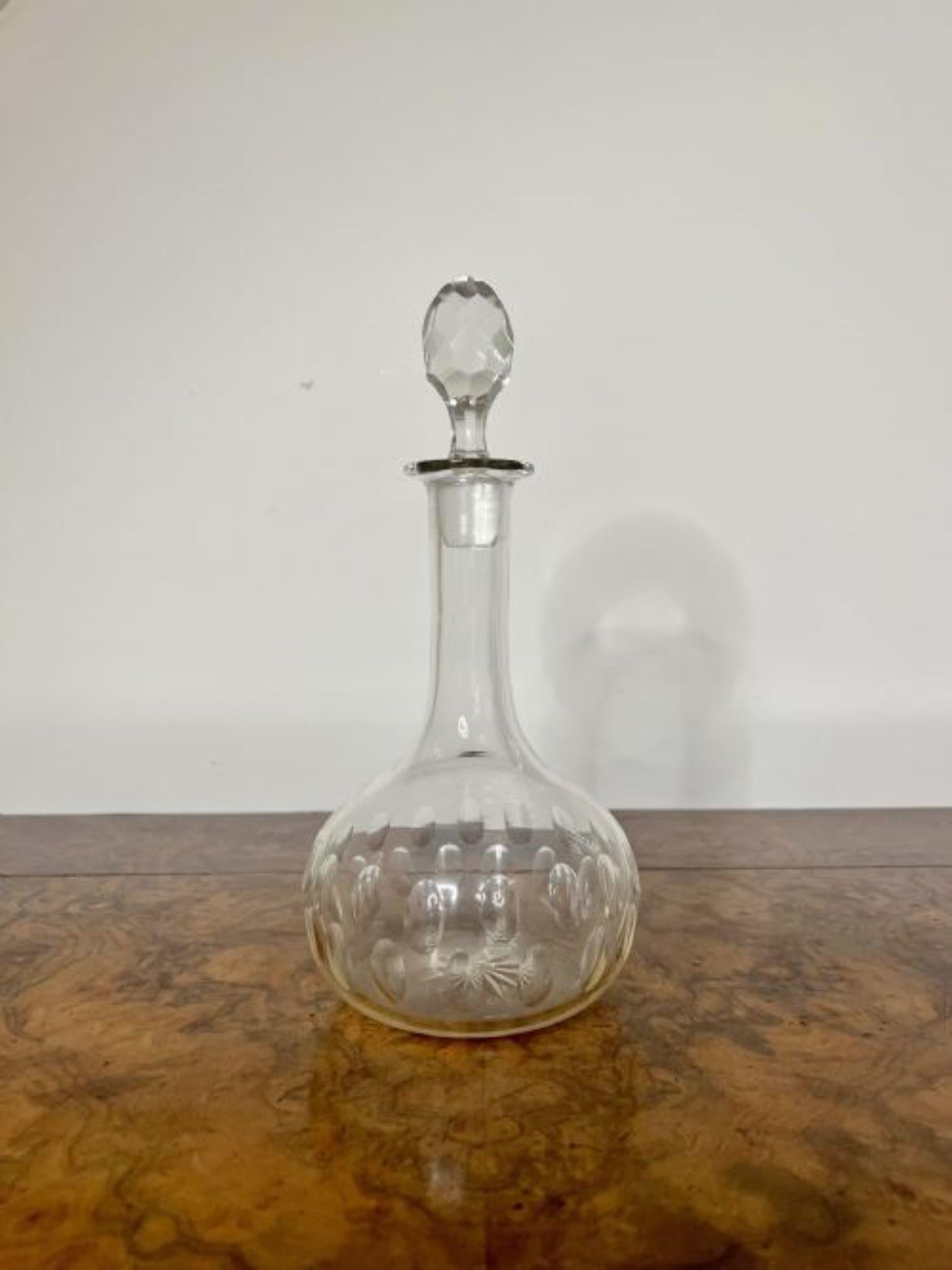 Lovely antique Edwardian glass decanter having a quality antique Edwardian glass decanter with a rounded body with circular patterns and the original cut glass stopper. 