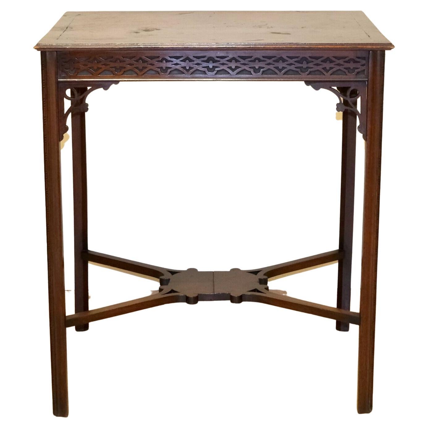 We are delighted to offer for sale this decorative Edwardian mahogany brown side table.

This beautiful piece shows carvings on each leg featuring a blind fretwork frieze which is identical front and back, so it can be used as a free standing table