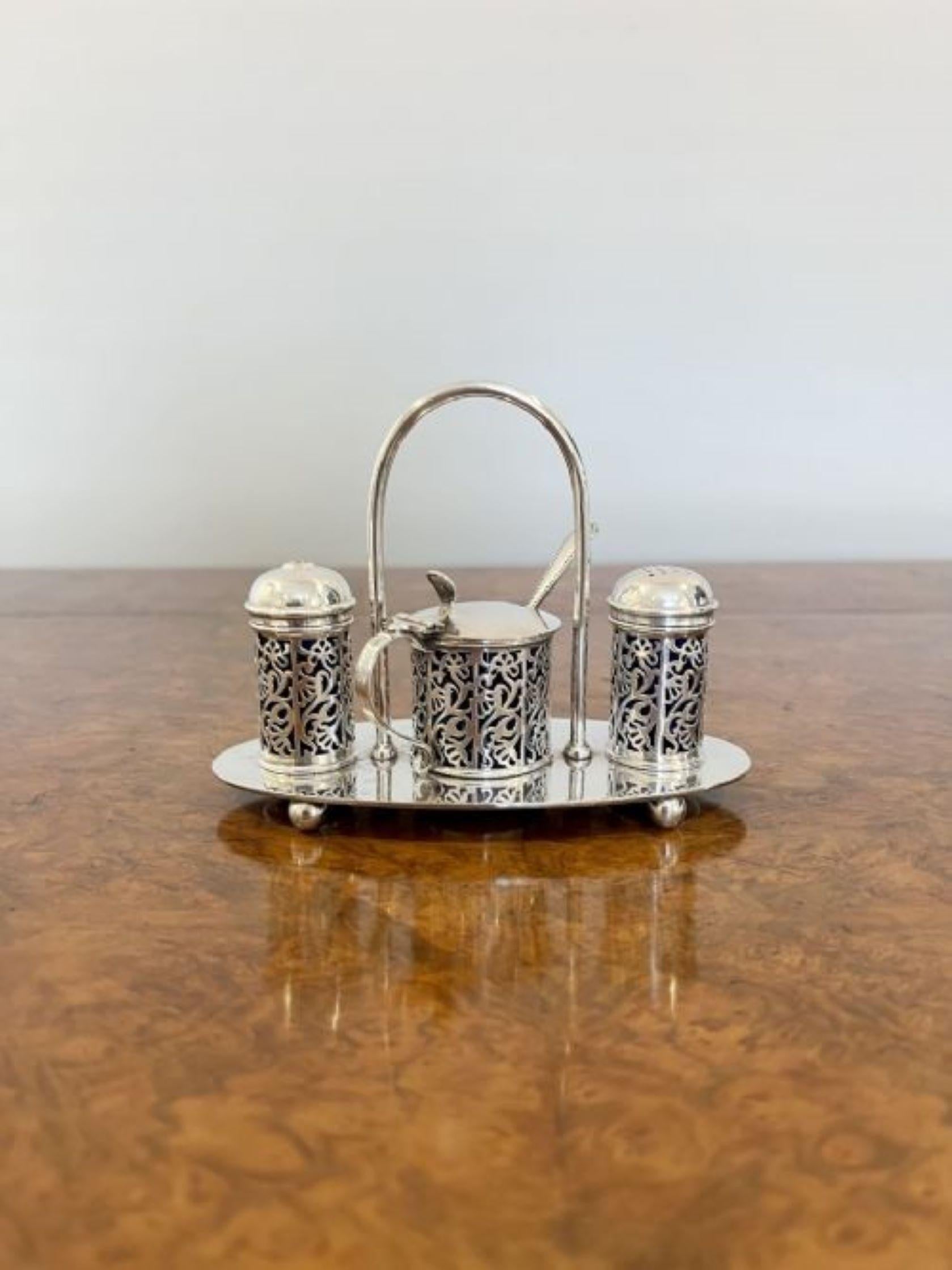 Lovely antique Edwardian quality glass and silver plated cruet set having a quality silver plated stand with a carrying handle to the centre with a ornate silver plated salt, pepper and mustard pot to the top of the stand with removable blue glass
