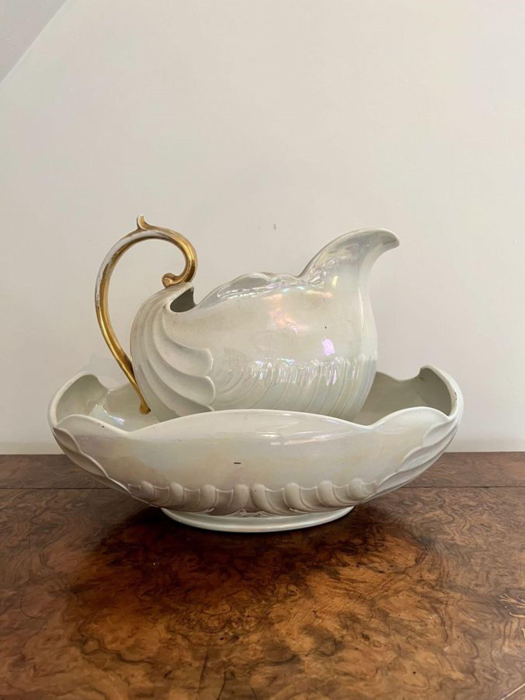Lovely antique Edwardian Shelley jug and bowl set having a wonderful pearl shimmer ground with a gold shaped handle to the back both in the form of a shell, 
Stamped to base
Rd 330395 

D. 1900