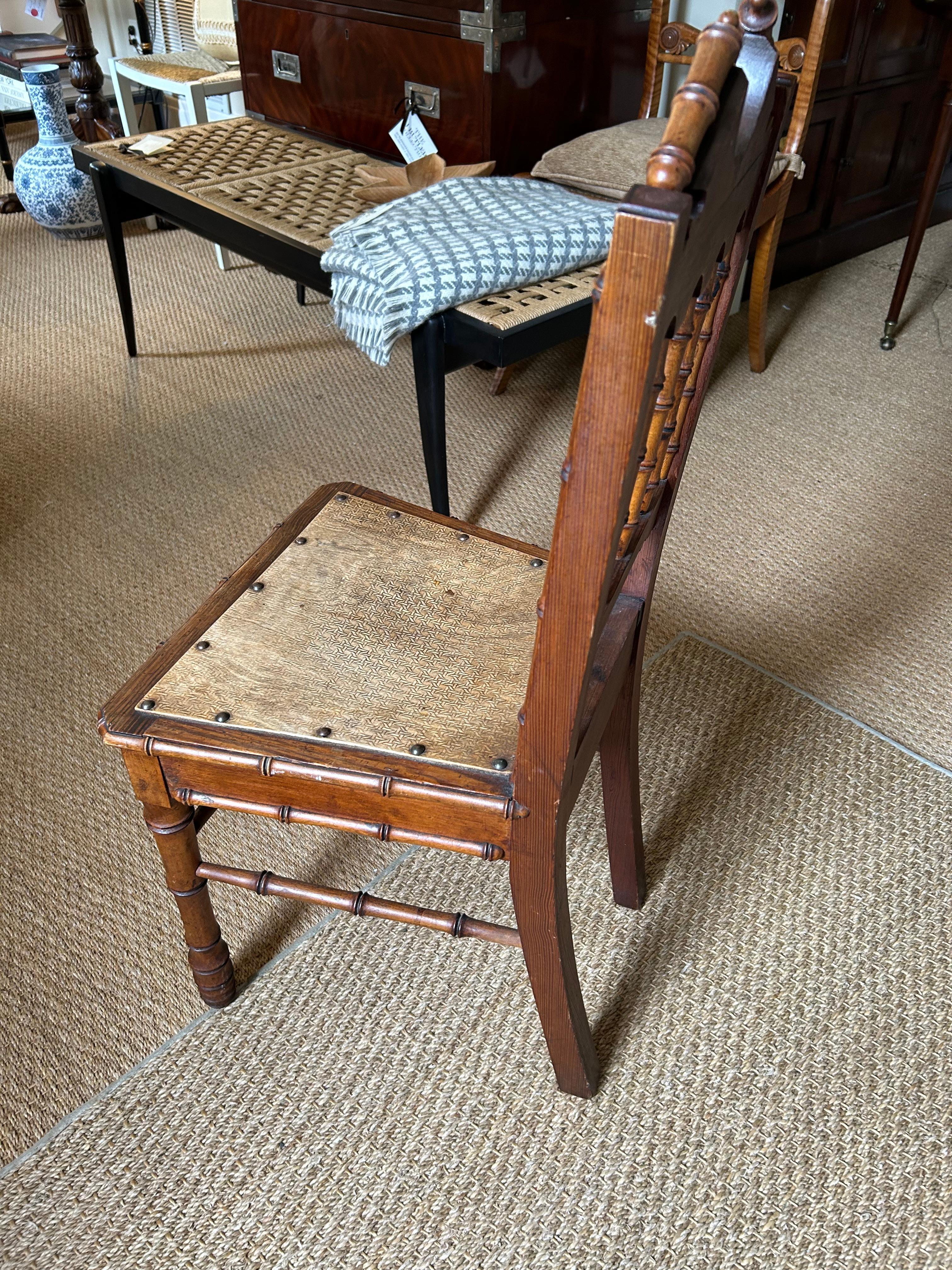 Character rich faux bamboo and wood English antique hall chair.  A great little extra chair for a special nook.