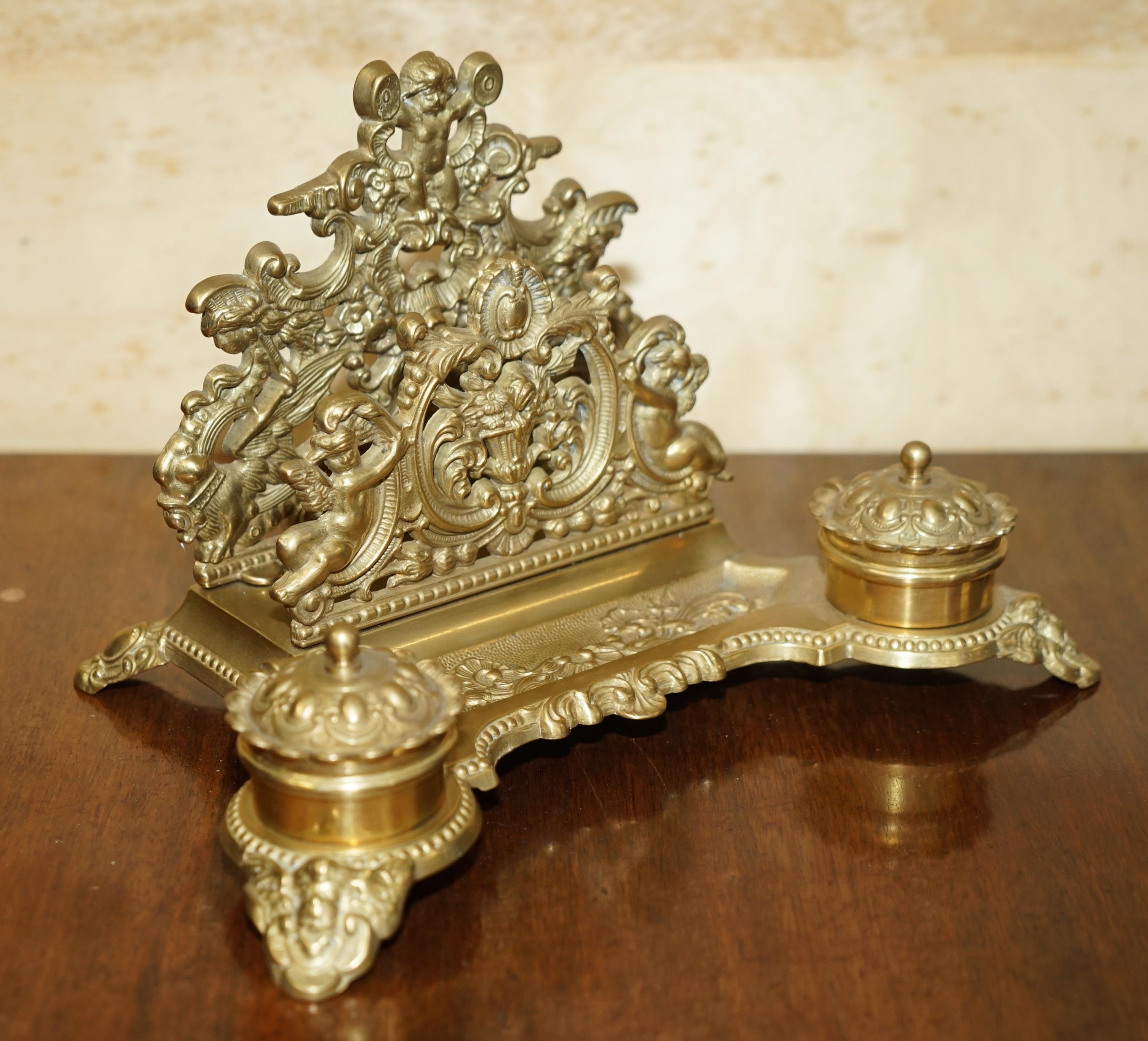 Royal House Antiques

Royal House Antiques is delighted to offer for sale this lovely antique French Baroque Repoussé gilt brass Cherub ink well letter holder stand

A very decorative and well made thing, circa 1900 and

The condition is perfect for