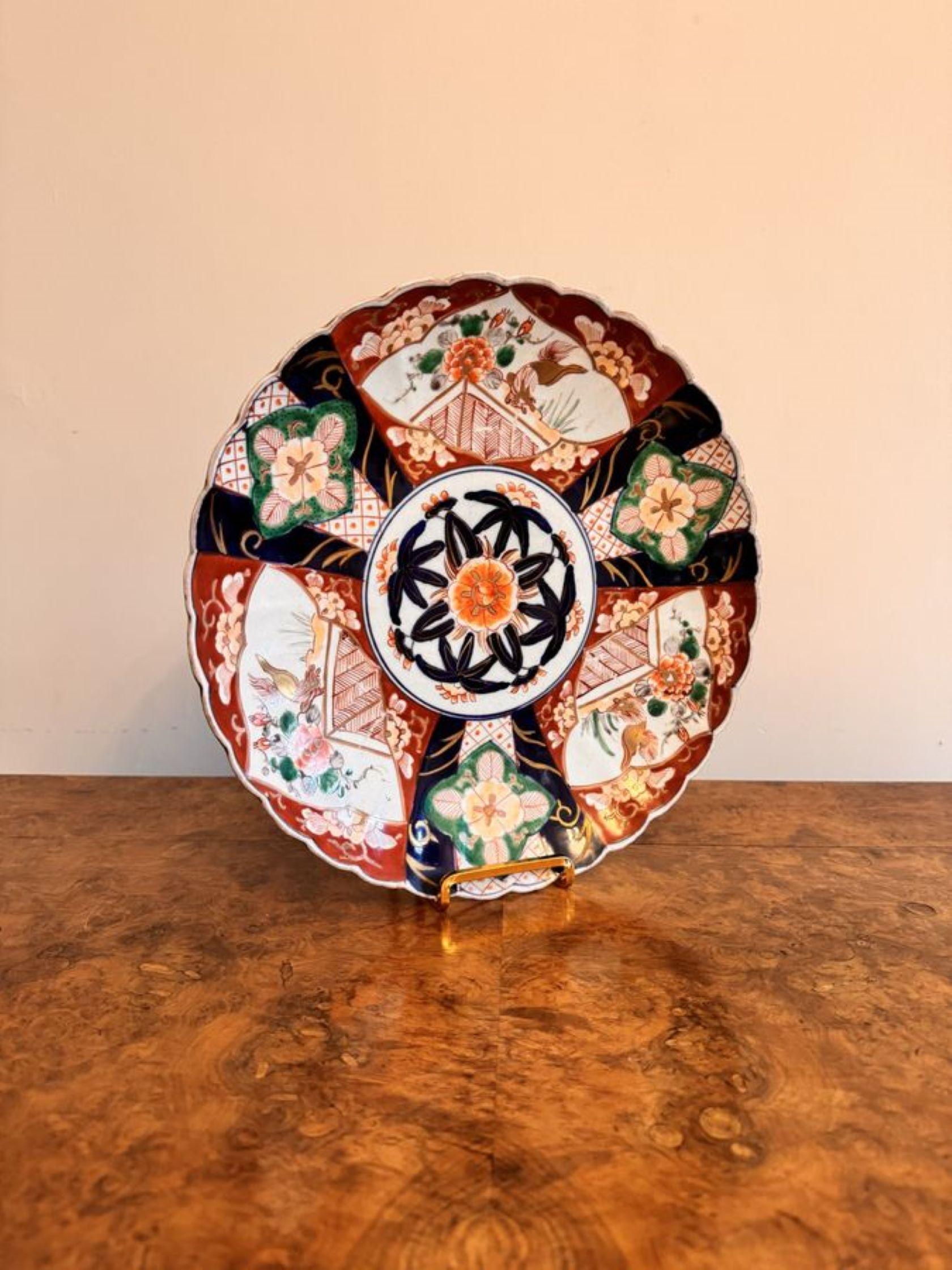 Lovely antique Japanese imari plate, having a quality Japanese imari plate with a patterned centre surrounded by panels with flowers and patterns in fantastic hand painted vibrant red, blue, green, white and gold colours. 

D. 1900