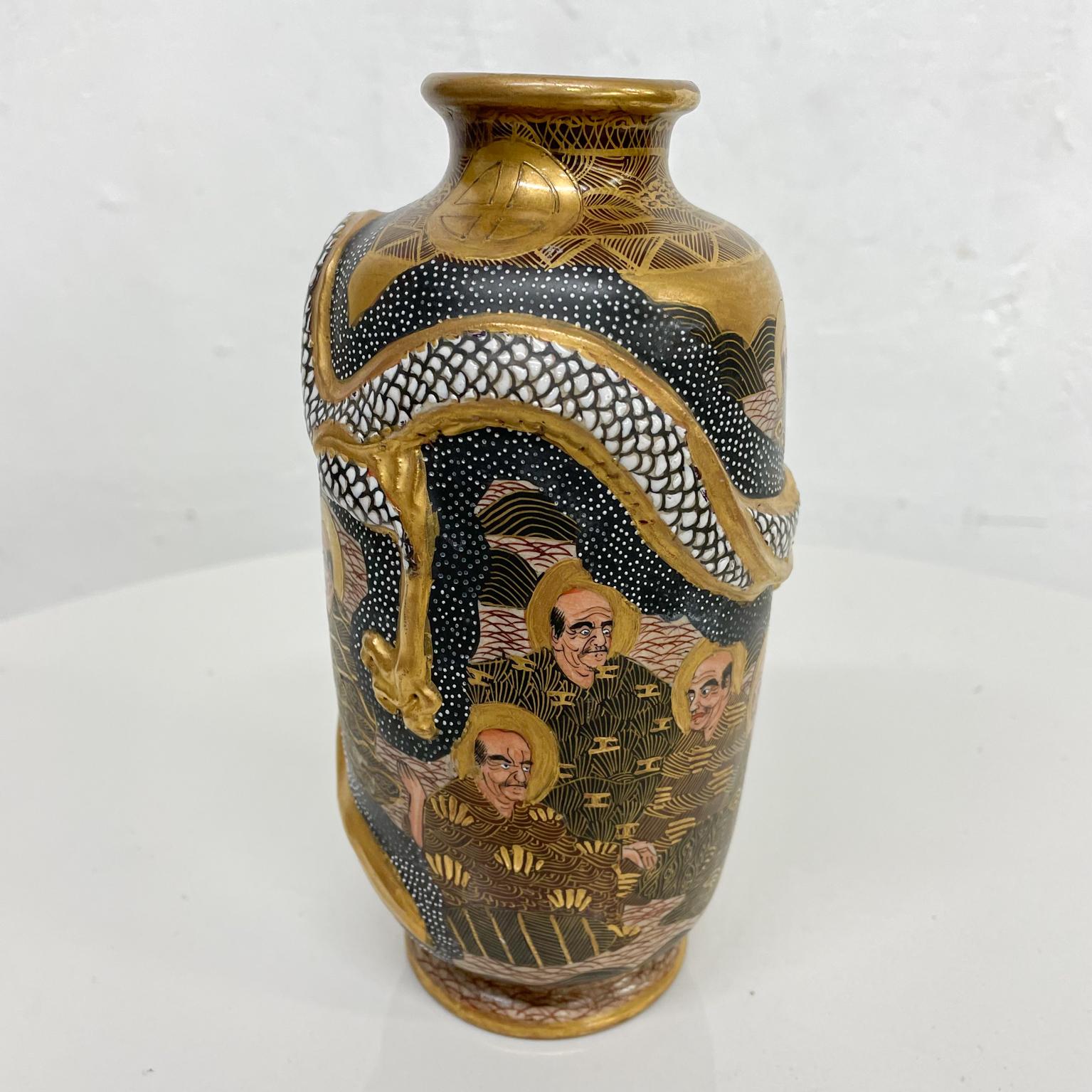 Satsuma vase
Lovely Japanese Satsuma pottery vase Arhat figures
Back gold and white with gilded decoration
Stamped at bottom
Measures: 7.25 tall x 3.5 diameter
Preowned original unrestored vintage condition
Refer to images.



