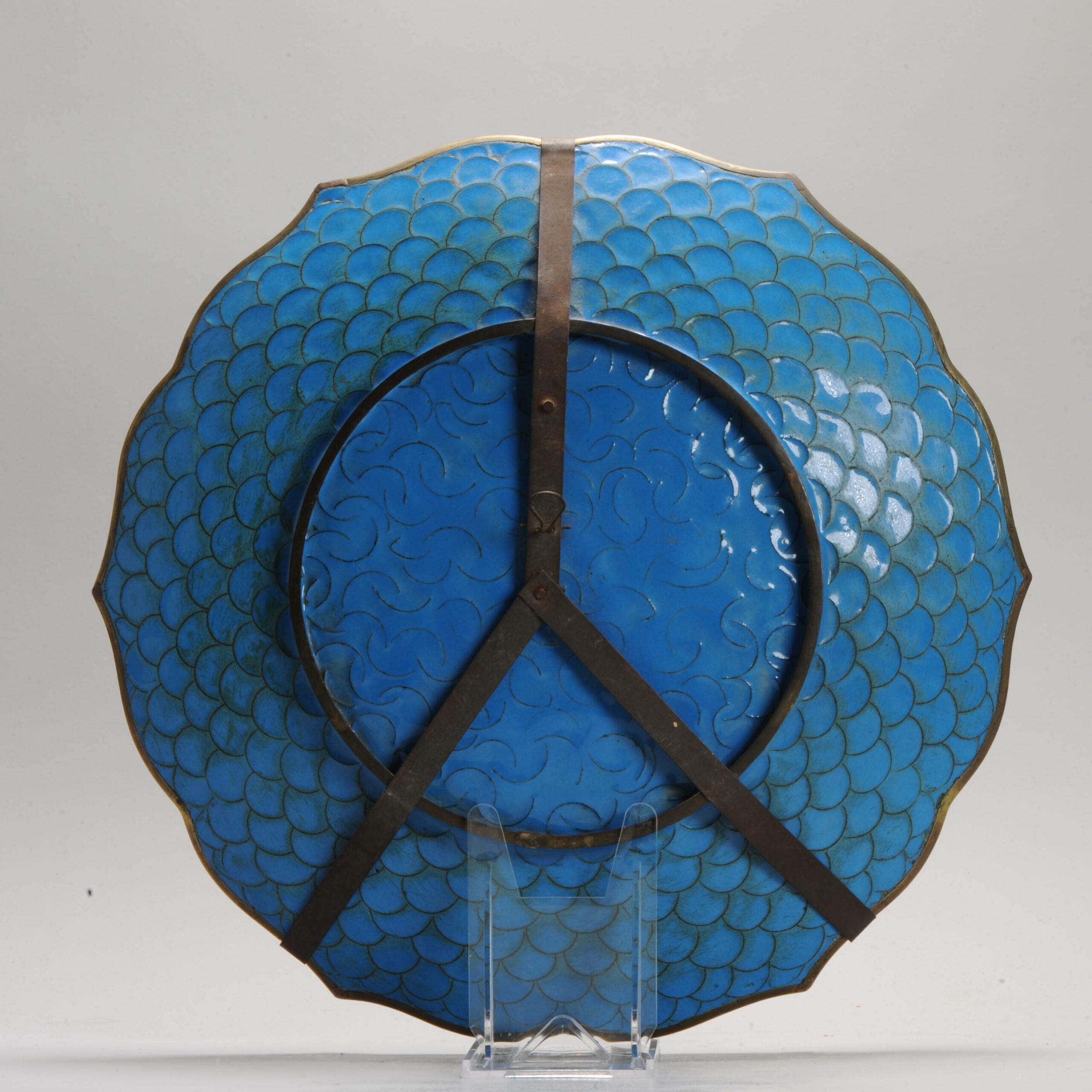 Lovely and beautifully made piece with different kind of flowers and birds on a green  base.

Cloisonné is an enamelling technique in which the pattern is formed by wires soldered to the surface of the object to be decorated, which is usually made
