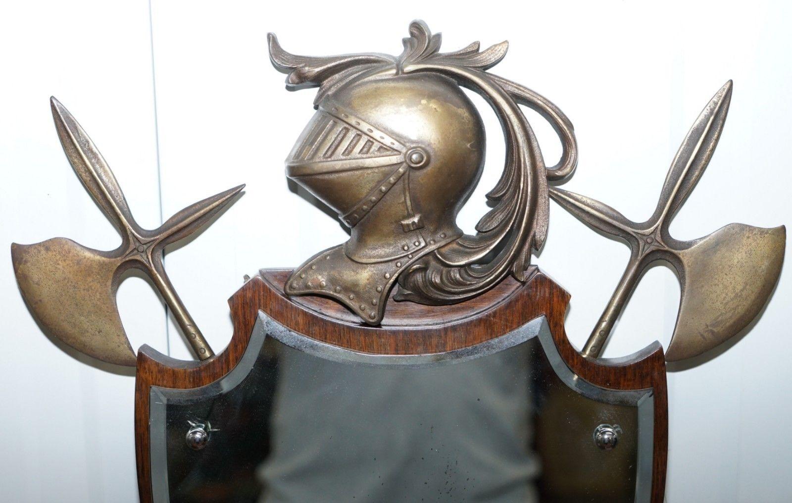 We are delighted to offer for sale this stunning antique wall mirror with armour and axe detailing in bronze mounts

A very good looking and decorative piece, the glass plate mirror is original, the bronze helmet has the foundry stamp and serial