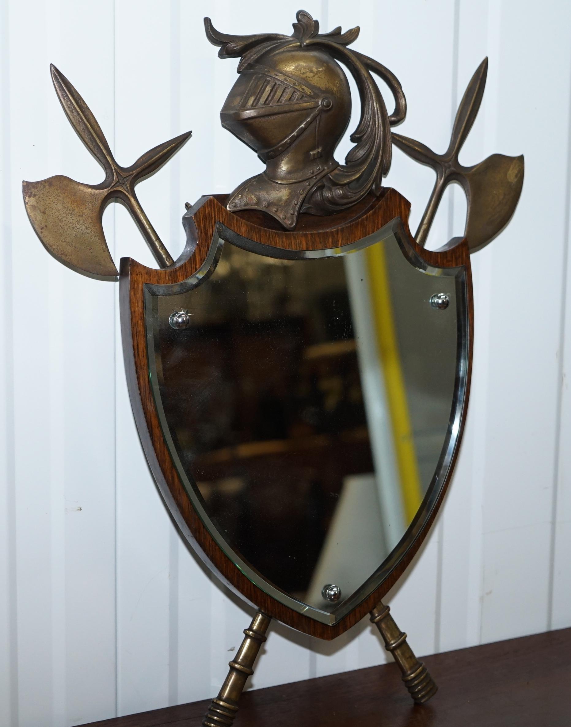 We are delighted to offer for sale this stunning antique wall mirror with armour and axe detailing in bronze mounts

A very good looking and decorative piece, the glass plate mirror is original, the bronze helmet has the foundry stamp and serial