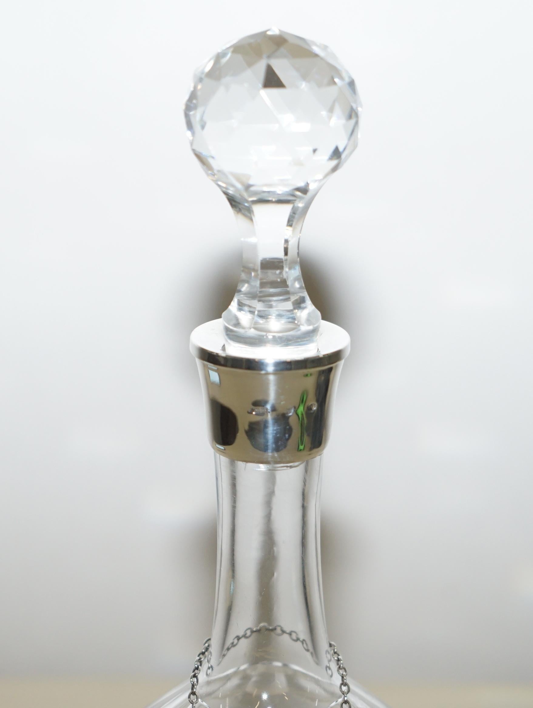 We are delighted to offer for sale this sublime cut glass crystal decanter with sterling silver collar and sterling silver sherry hanging label

A good looking and decorative piece, the collar is hallmarked however its heavily faded, the hanging