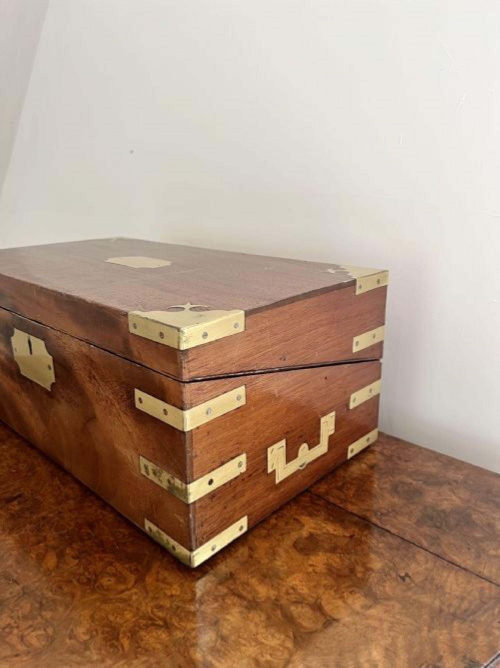 Lovely antique Victorian burr walnut and brass bound writing box having a quality burr walnut writing box with brass mounts, opening up to reveal a writing slope with upholstered green felt, lifting up to reveal a storage compartment and three