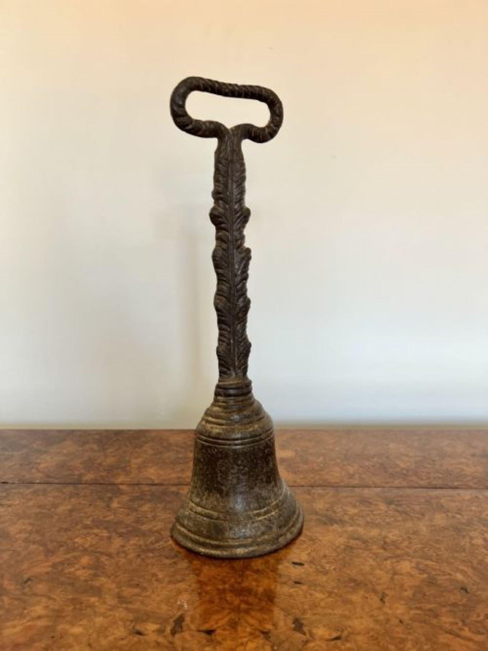 Lovely antique Victorian Kenrick cast iron doorstop having a lovely cast iron doorstop with a  pierced loop handle above an acanthus leaf decorated stem and a bell to the base, stamped Kenrick 440. 
