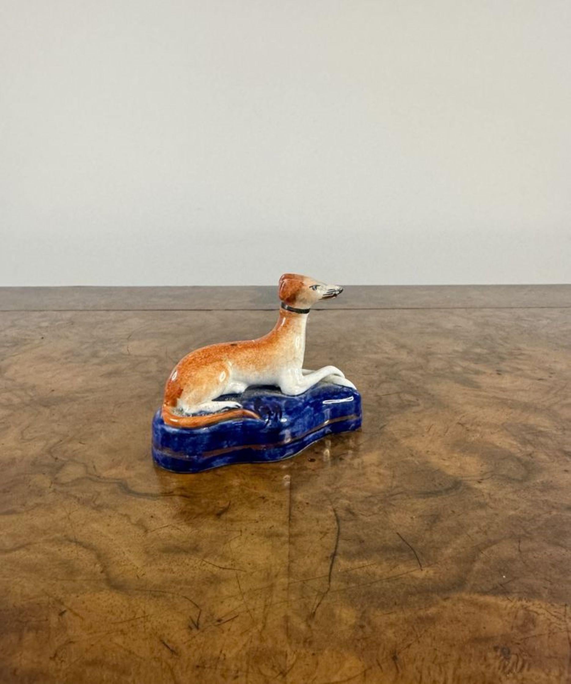 Lovely antique Victorian miniature Staffordshire greyhound, having a quality antique Victorian Staffordshire greyhound mounted on a blue shaped base. 

D. 1850