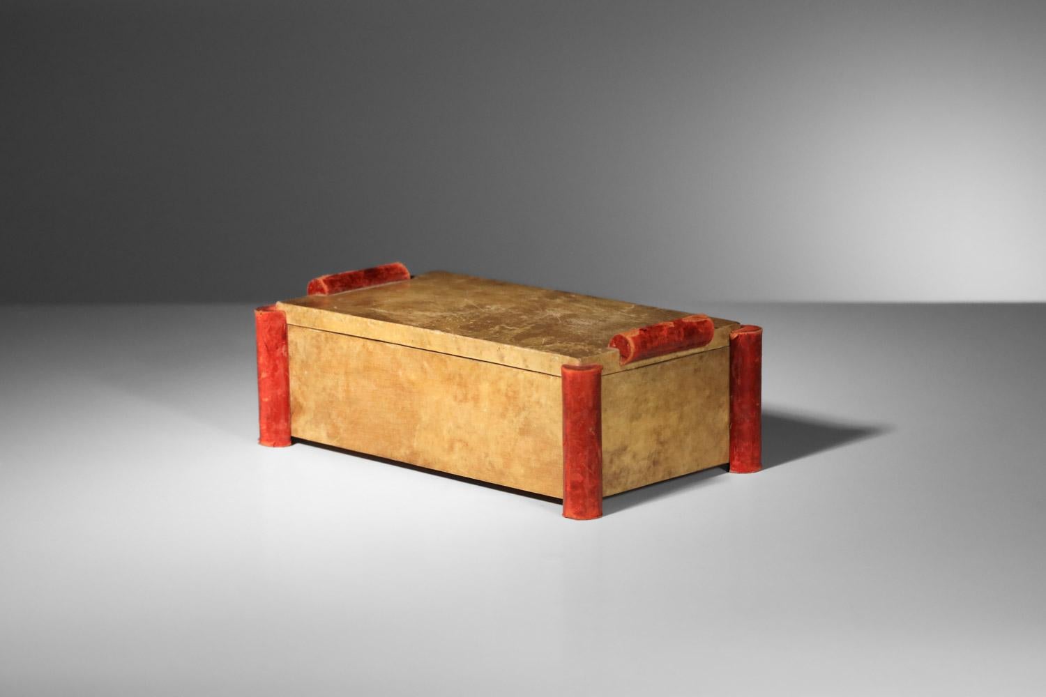Nice French Art Deco decorative box from the 1940s in the taste of Paul Dupré-Lafon's work. It is covered with parchment (velin) and red-tinted kid leather on the handles and corners. Very fine vintage condition, with traces of age and use
