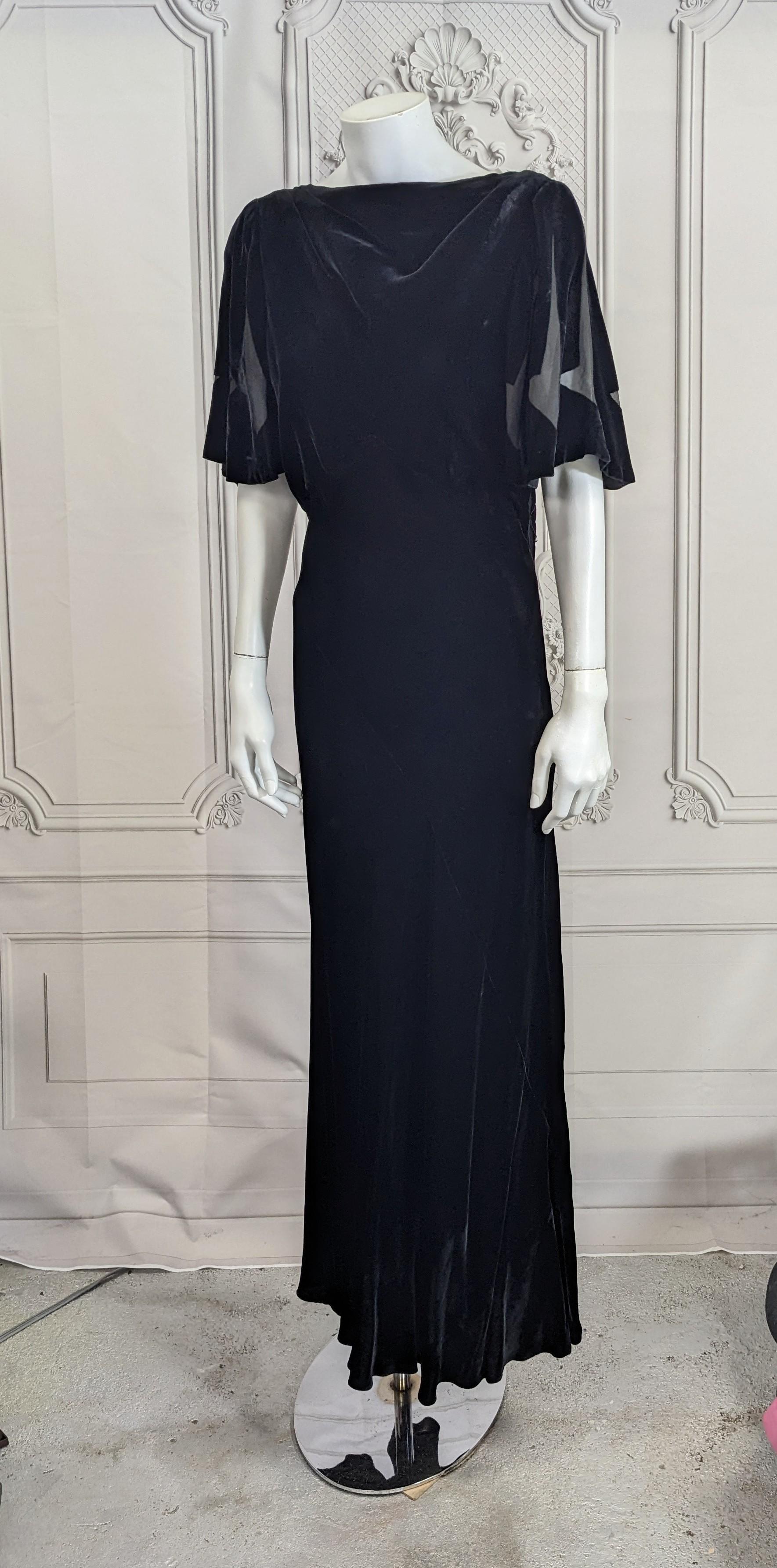 Lovely Art Deco Burn Out Velvet Gown from the 1930's. Typical bias slim cut velvet with flutter sleeves with incredible sheer Art Deco arrow designs radiating out. 
Side snap opening. Slim cut small size 2-4. circa 1930's USA. 