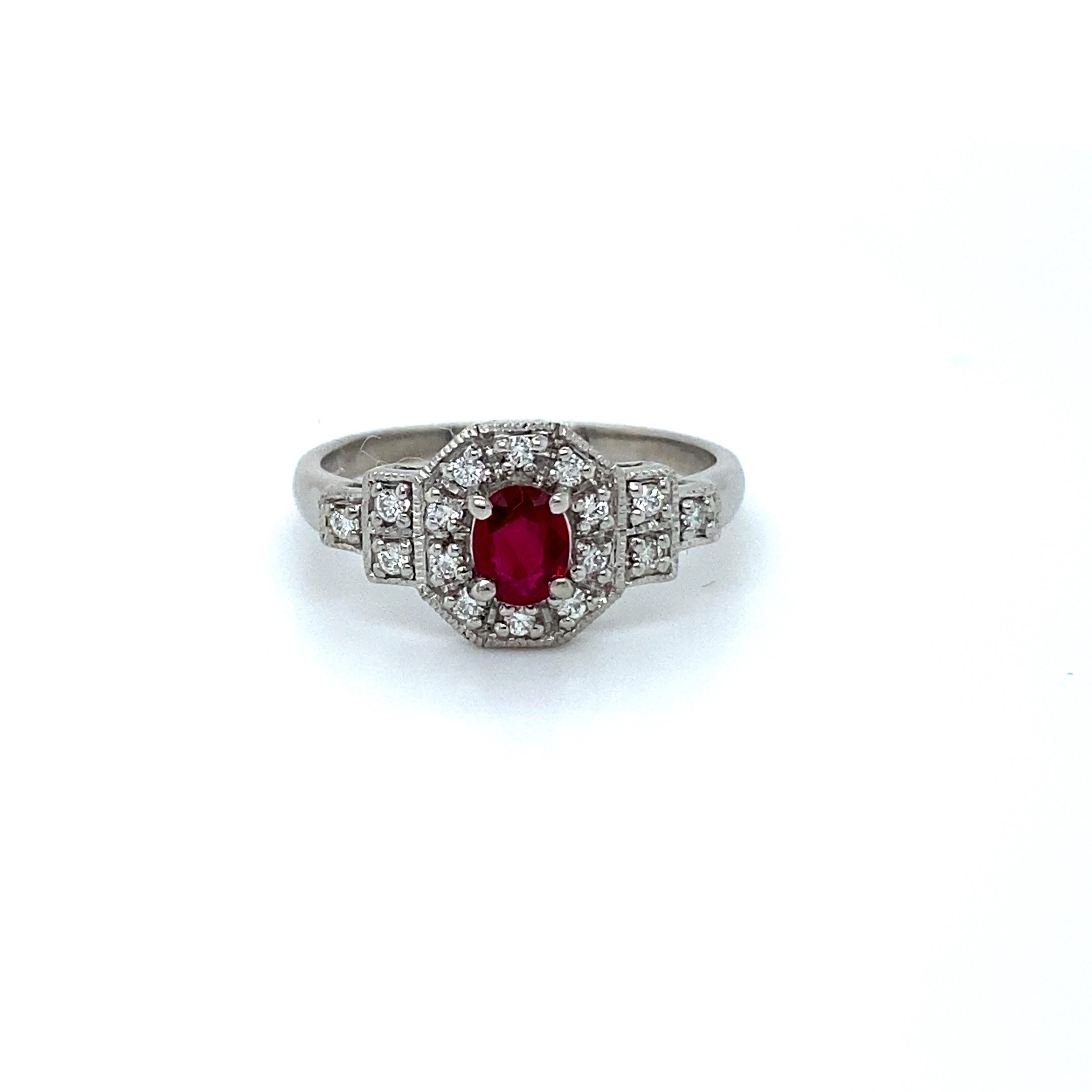 So Pretty! I just love this Art Deco Platinum Diamond and Ruby Engagement Ring! Such a great classic form! Crafted in Platinum, the design features a classic Art Deco cluster look. In the center, the ring features One Oval Cut Natural Ruby,