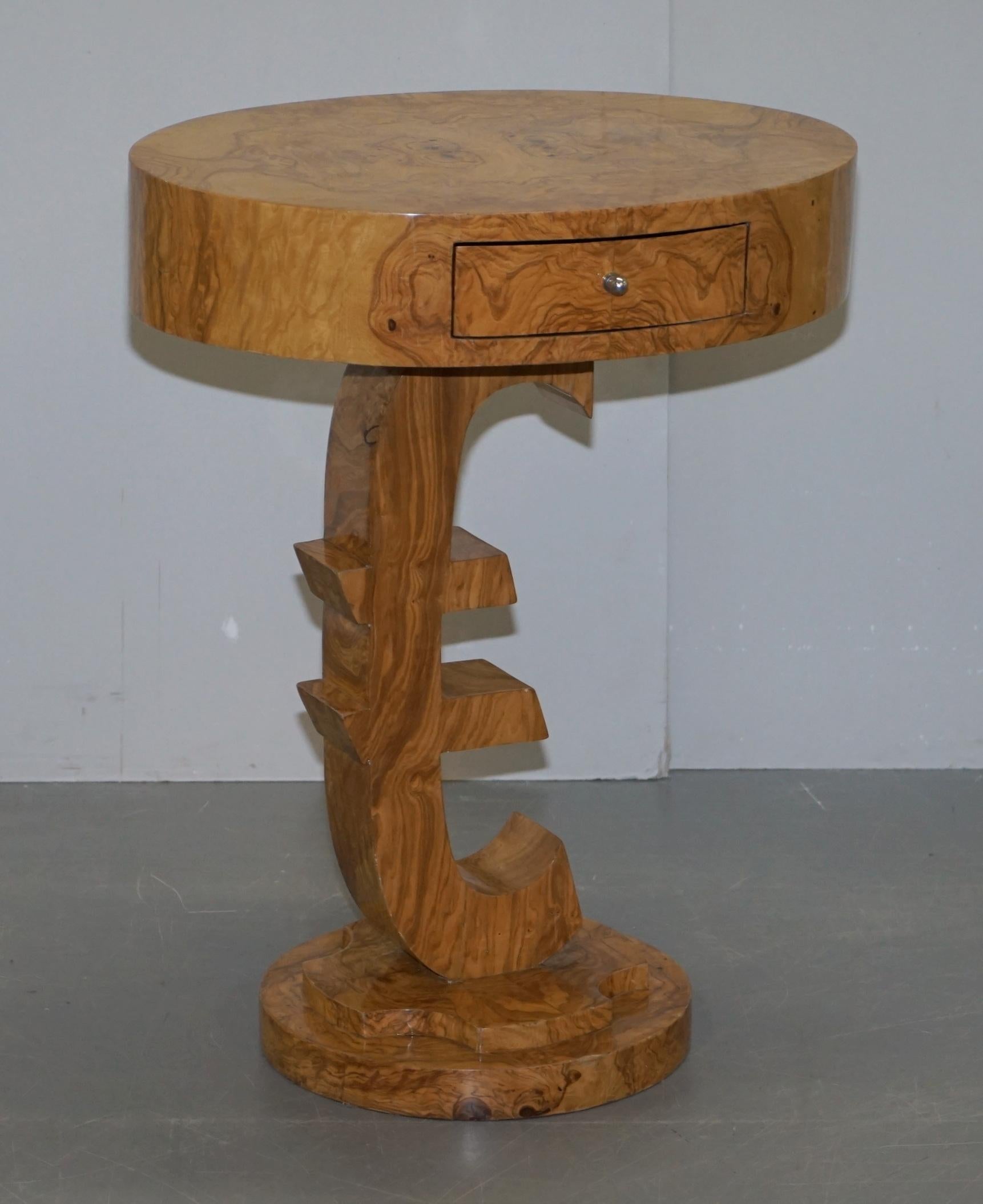 We are delighted to offer for sale this lovely Art deco style burr walnut lamp or side table with a Euro sign base

A very well made piece, it has a single drawer, its after the styles with this type of timber, of the art deco pieces, naturally
