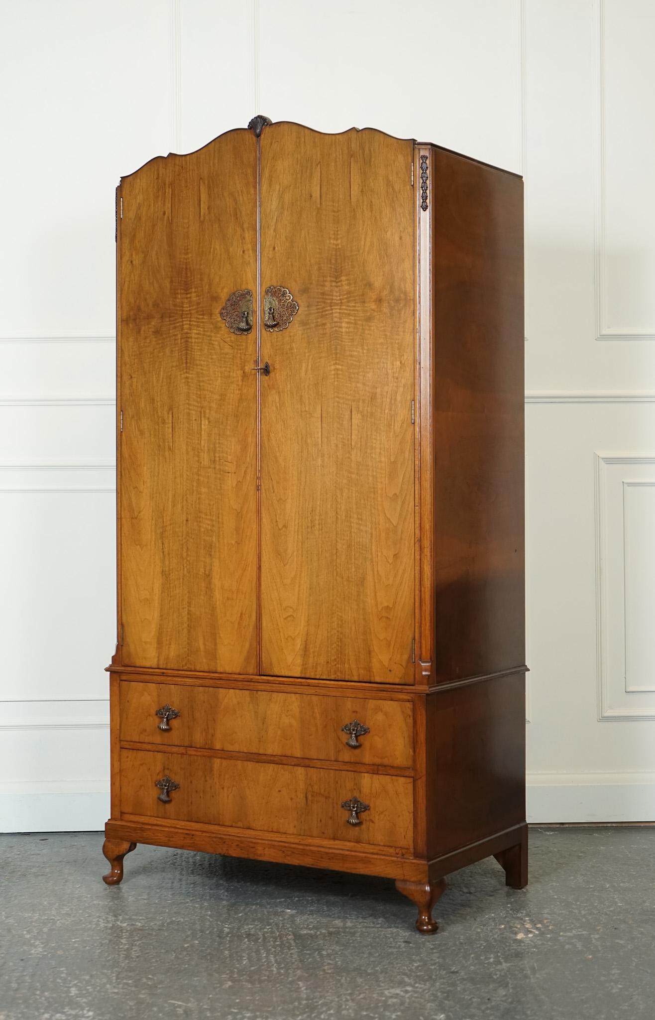 Antiques of London



We are delighted to offer for sale this Lovely Art Deco Walnut Queen Anne Legs Double Wardrobe.

A lovely Art Deco style walnut double wardrobe with Queen Anne legs is an exquisite furniture piece that adds charm and