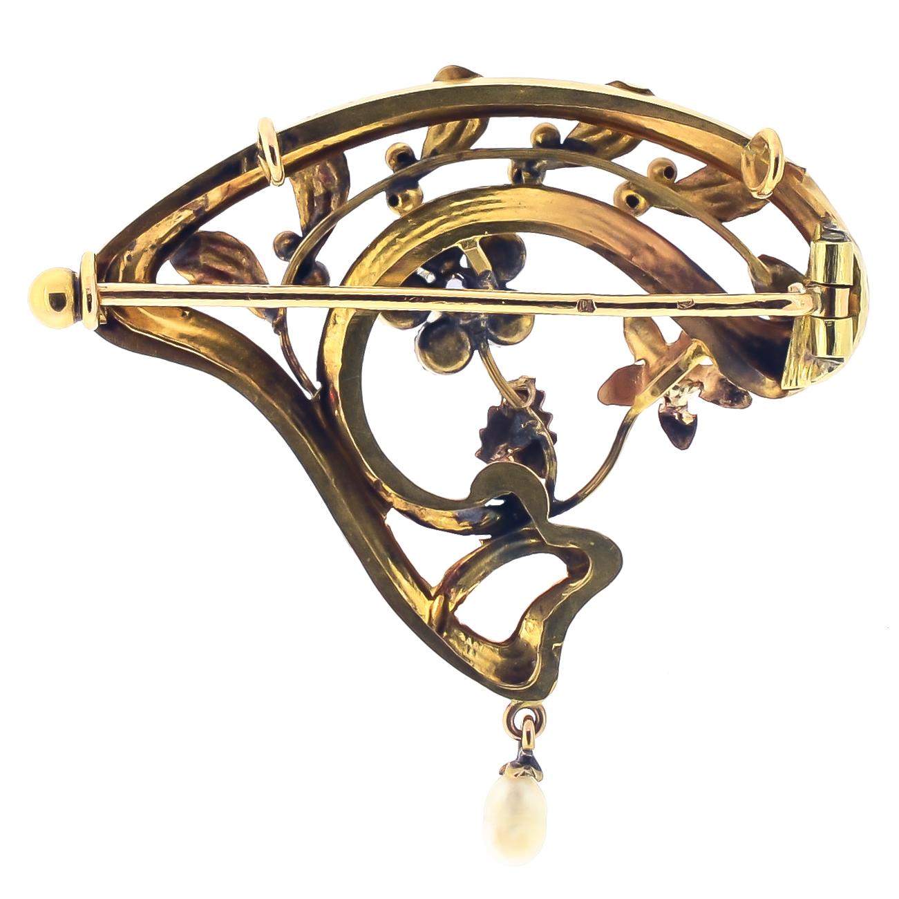 Lovely antique Art Nouveau French brooch with pearl flowers, applied gold leaves, and pearl dangle. Reverse: French eagle hallmark on c-clasp, tube hinge, pin stem original.

Dimensions: 1.50