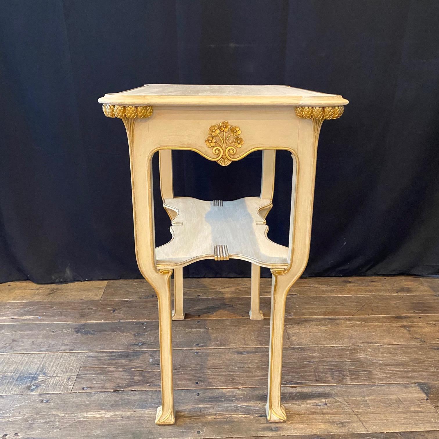 Lovely and elegant Art Nouveau Italian side table in neutral off white and gold, of an excellent smaller size to serve in any room of the home. Can be sold separately; part of an 11-piece early 20th century Art Nouveau complete original salon suite