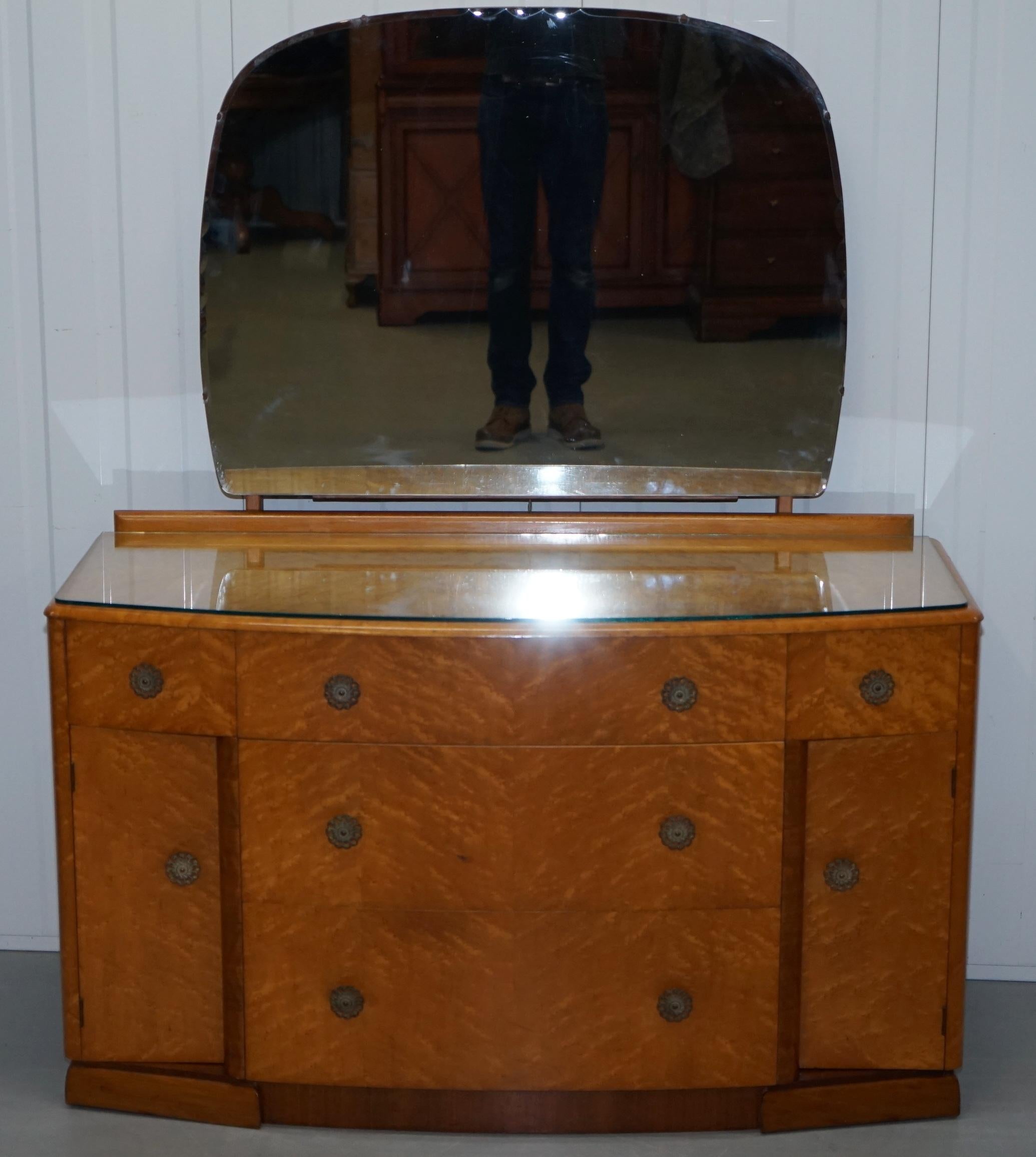 We are delighted to offer for sale this bird's-eye maple midcentury dressing table by Tudor Rose Bros LTD 

Handmade in England by one of the finest companies for their time for this type of work

This piece has a removable glass top as you can