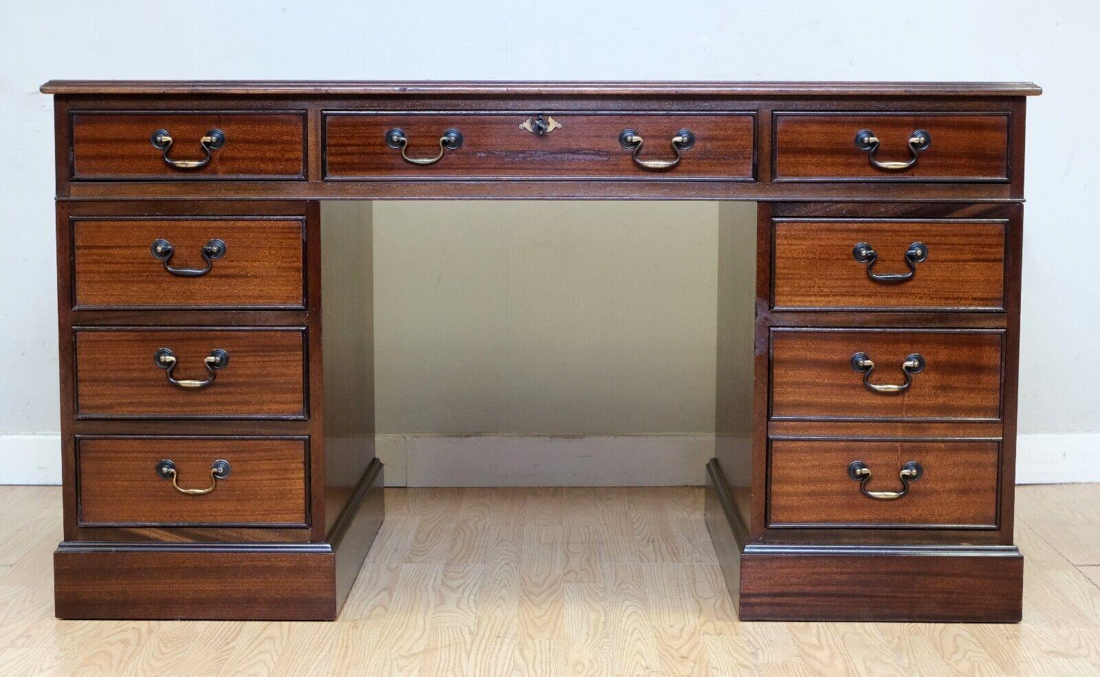We are delighted to offer for sale this classic Mahogany desk with black leather top and gold tooling. 

This good looking and decorative piece is ideal for your office or to be placed anywhere in your home since this gorgeous piece gives its deep