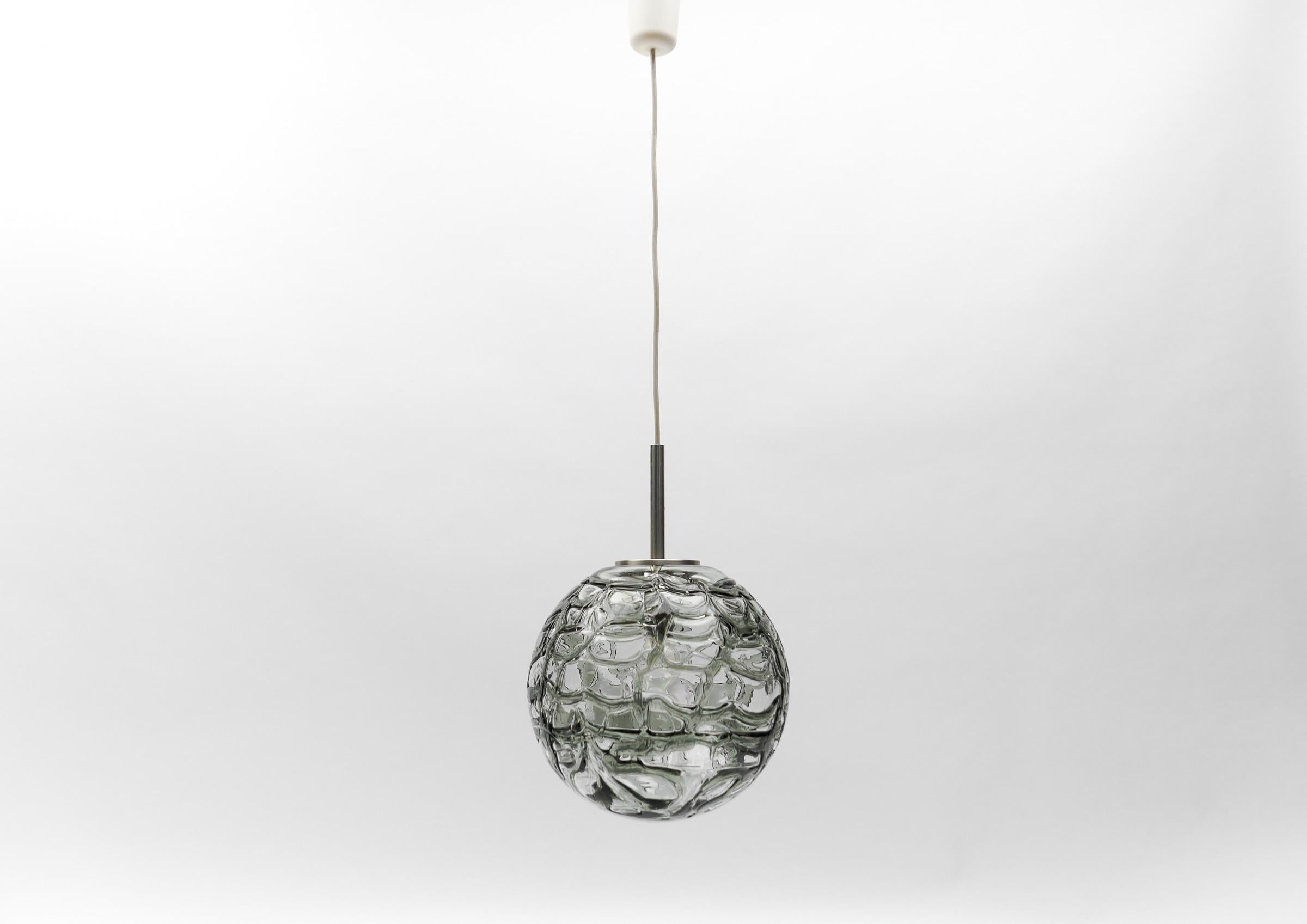 Lovely Black Murano Glass Ball Pendant Lamp by Doria, - 1960s Germany

Dimensions
Diameter: 11.81 in. (30 cm)
Height: 41.33 in. (105 cm)

One E27 socket. Works with 220V and 110V.

Our lamps are checked, cleaned and are suitable for use in the USA.