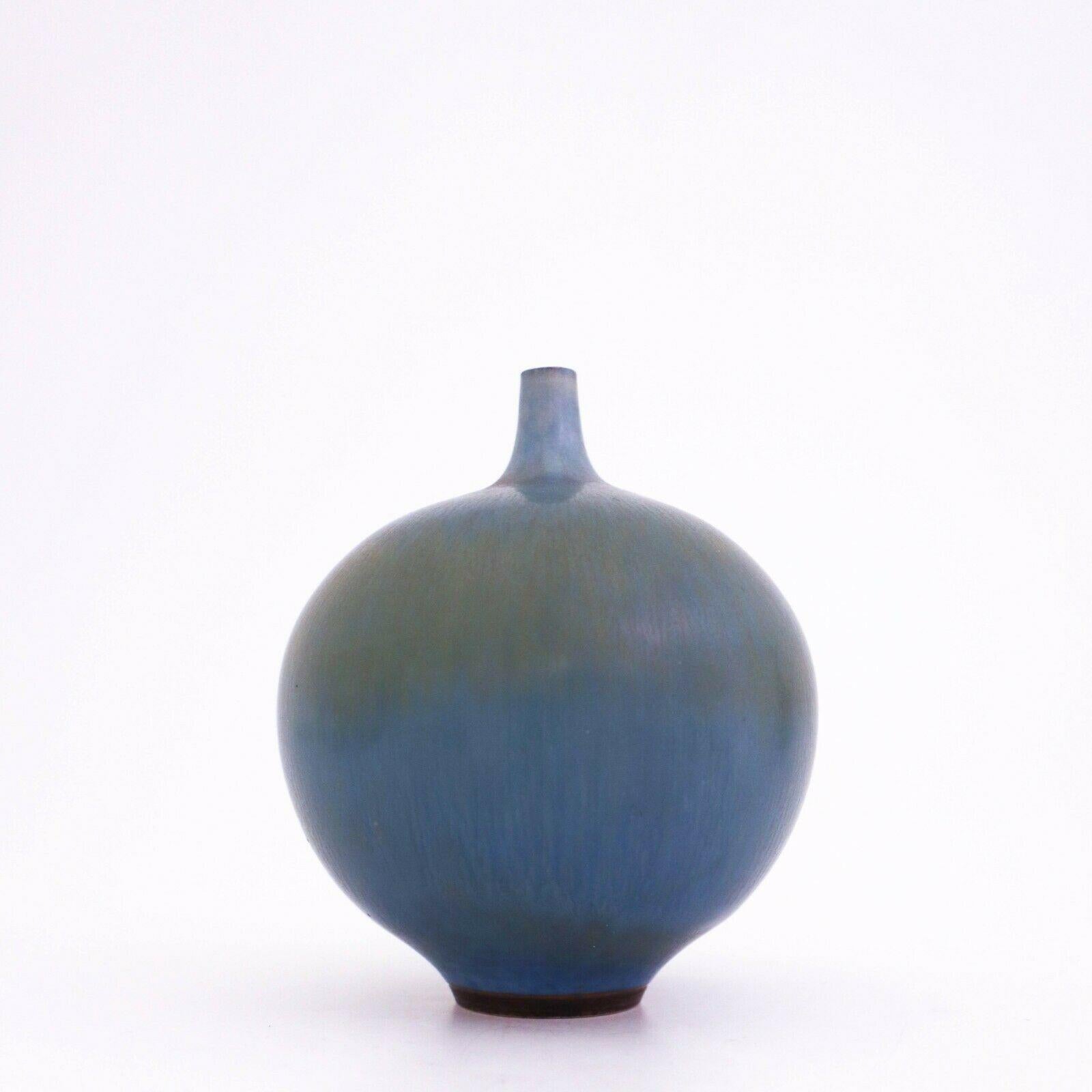 A lovely blue vase designed by Berndt Friberg at Gustavsberg in Stockholm, the vase is 10.5 cm high with a lovely harfur glase. It ´s marked as on picture and was made in 1960. It is in very good condition except from some minor marks.