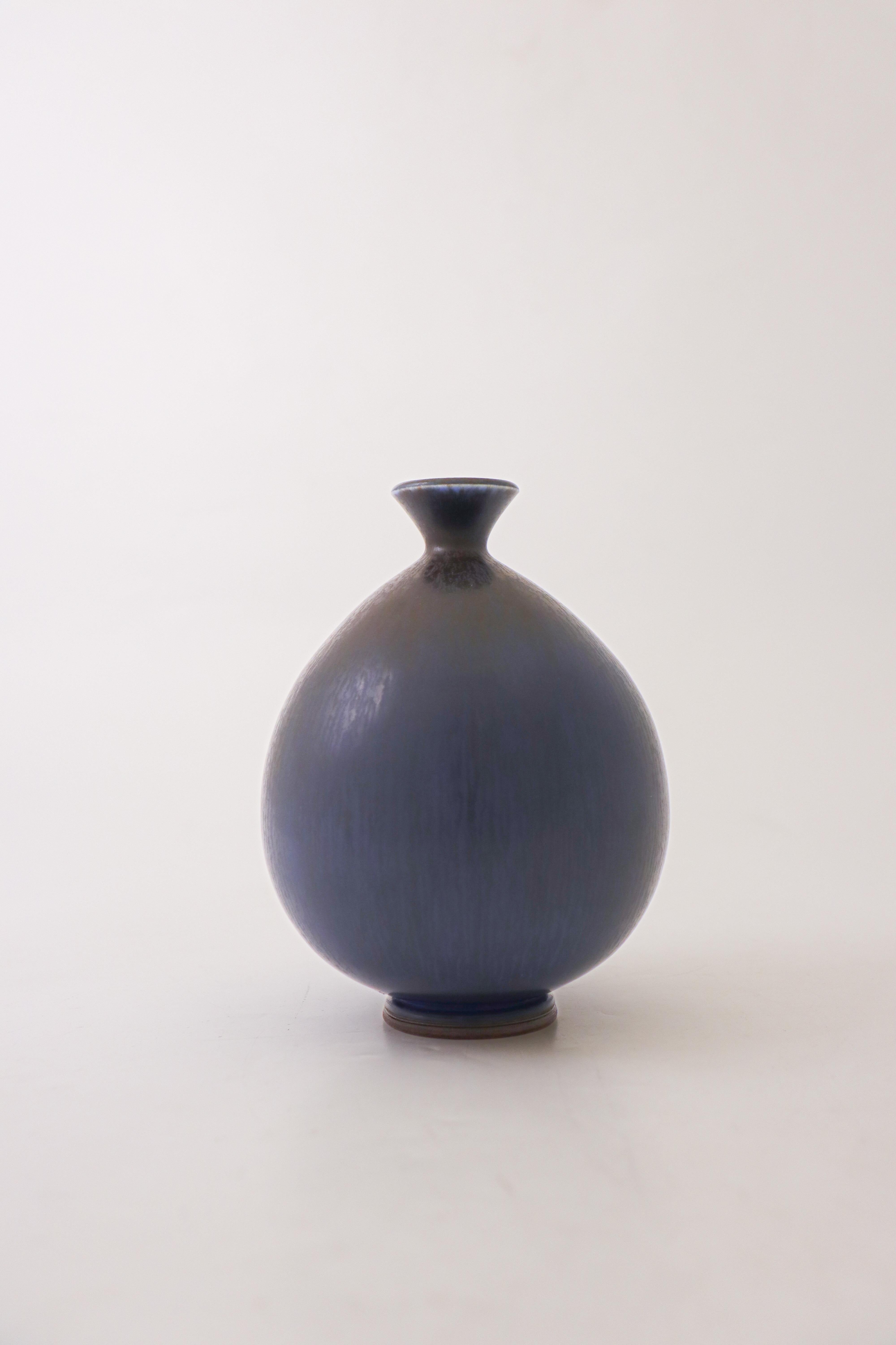 A deep blue vase designed by Berndt Friberg at Gustavsberg in Stockholm, the vase is 15 cm (6