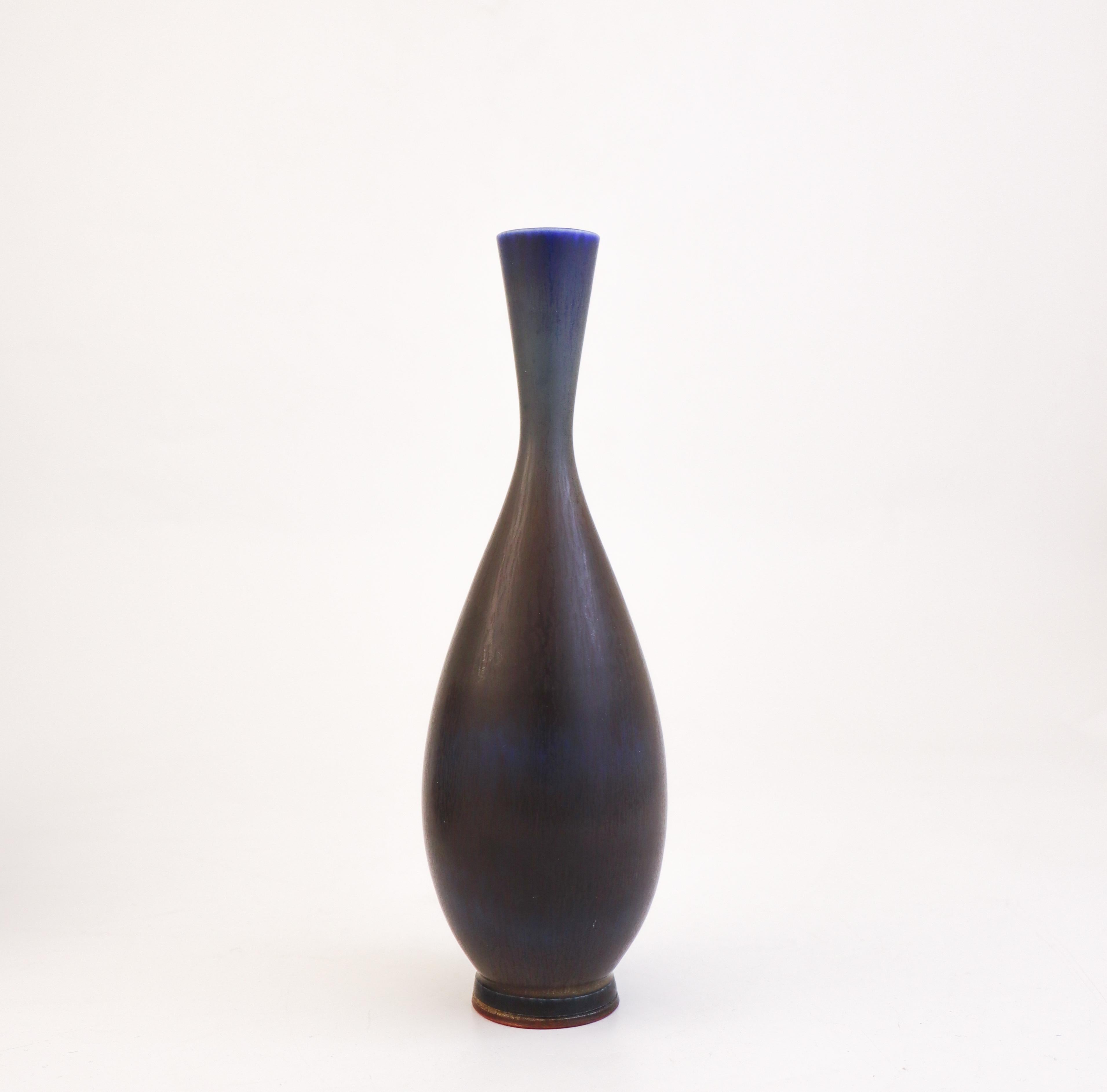 A deep blue vase designed by Berndt Friberg at Gustavsberg in Stockholm, the vase is 23 cm (9.2