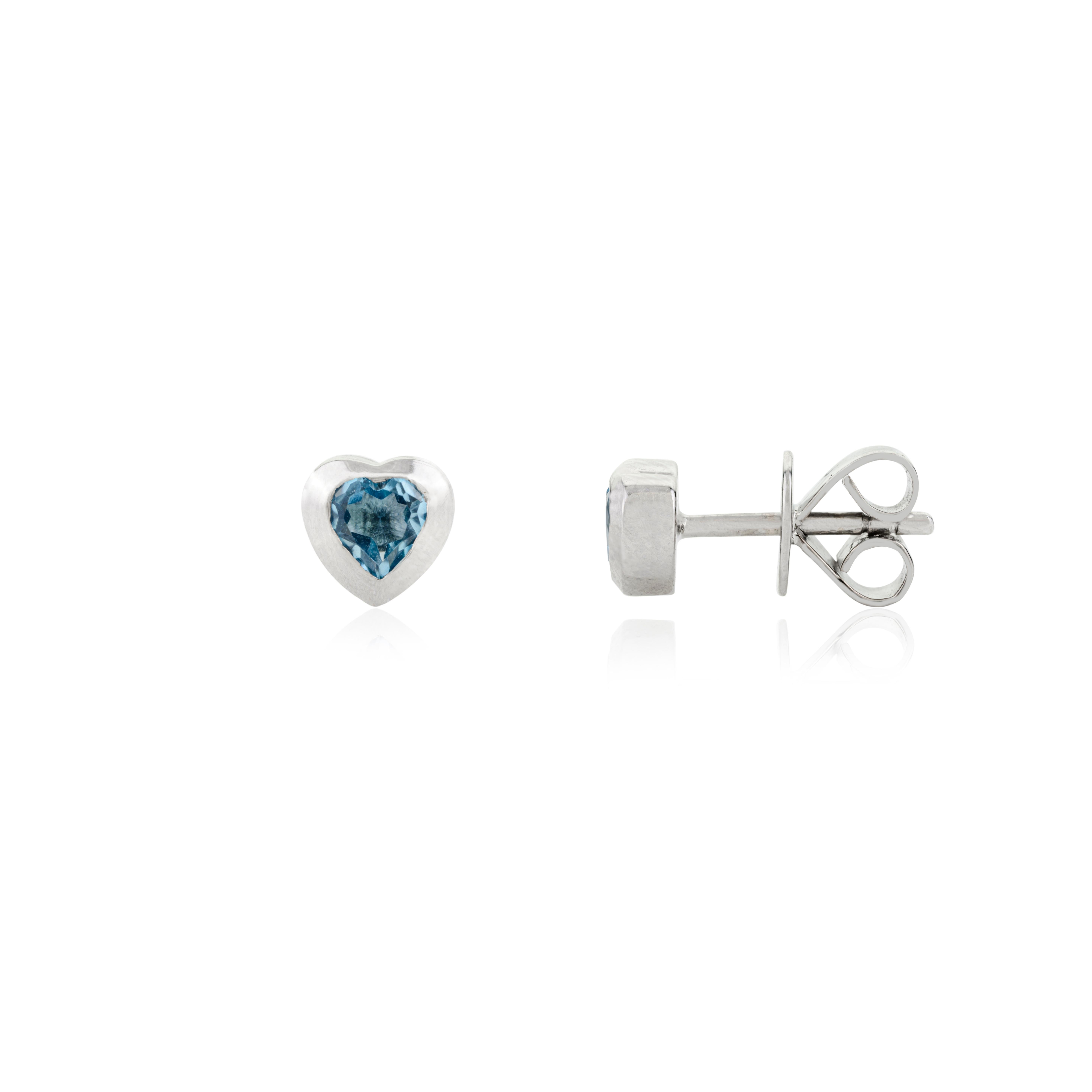 Modern Lovely Blue Topaz Heart Shaped Stud Earrings Bezel Set in 14 Karat White Gold For Sale