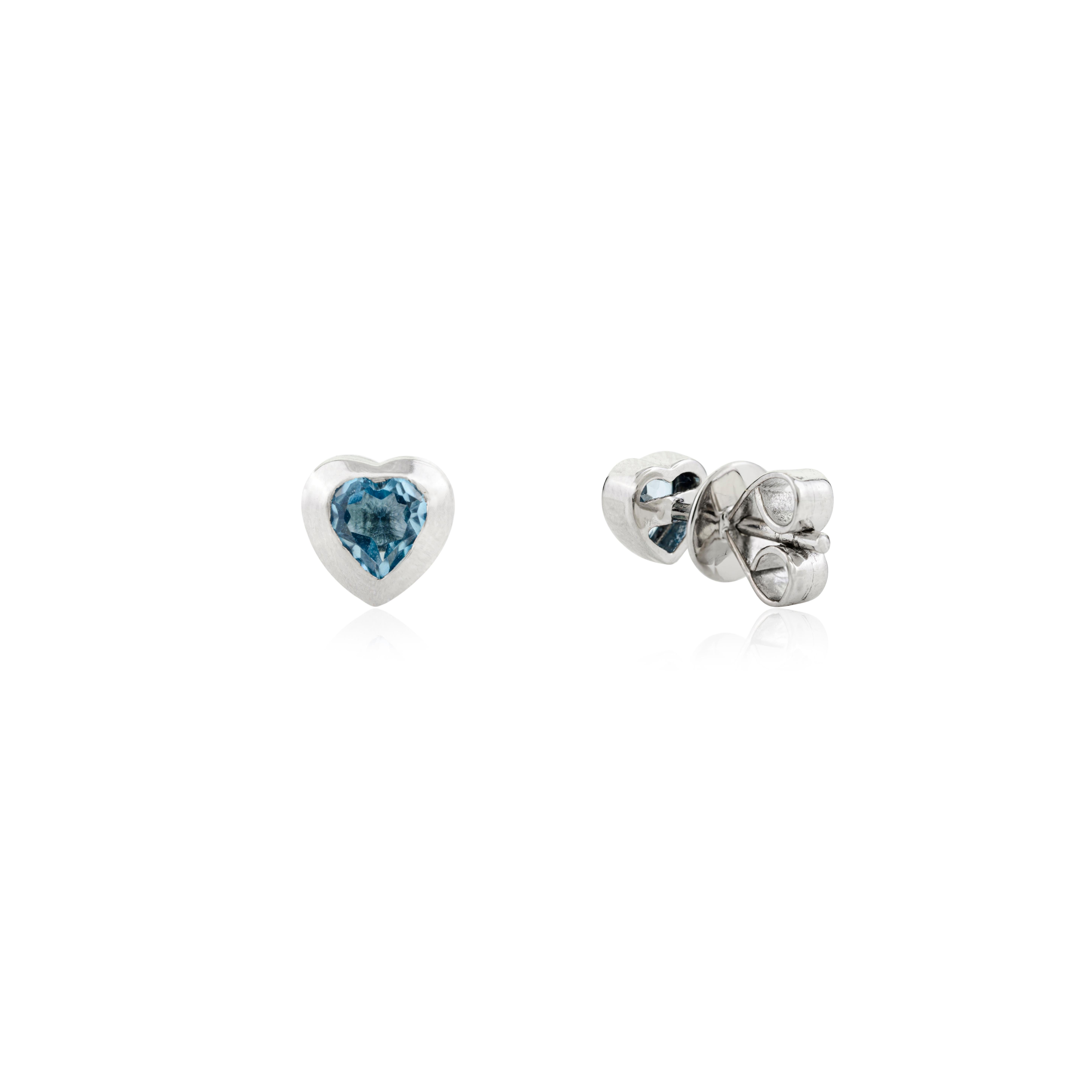 Lovely Blue Topaz Heart Shaped Stud Earrings Bezel Set in 14 Karat White Gold In New Condition For Sale In New York, NY