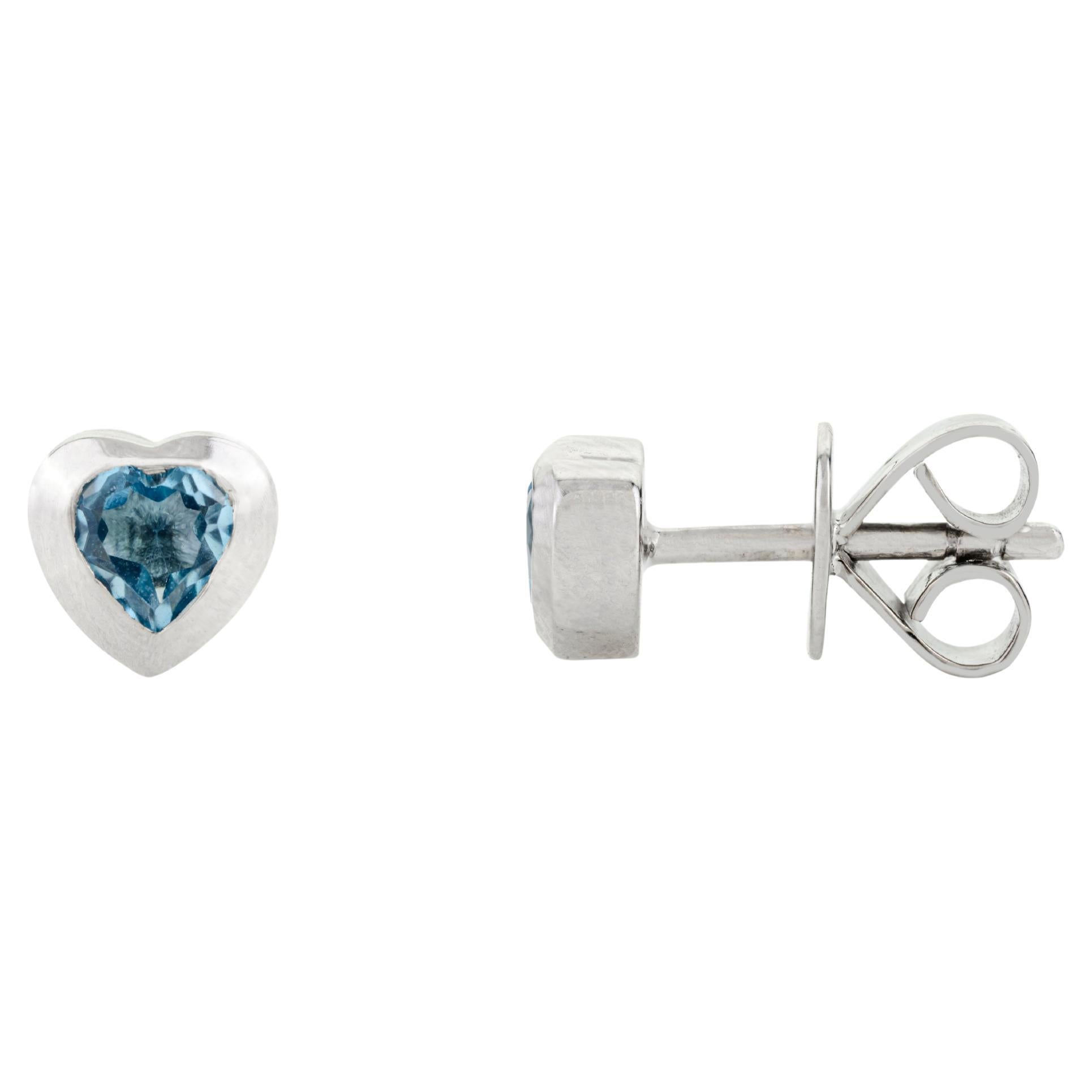 Lovely Blue Topaz Heart Shaped Stud Earrings Bezel Set in 14 Karat White Gold For Sale