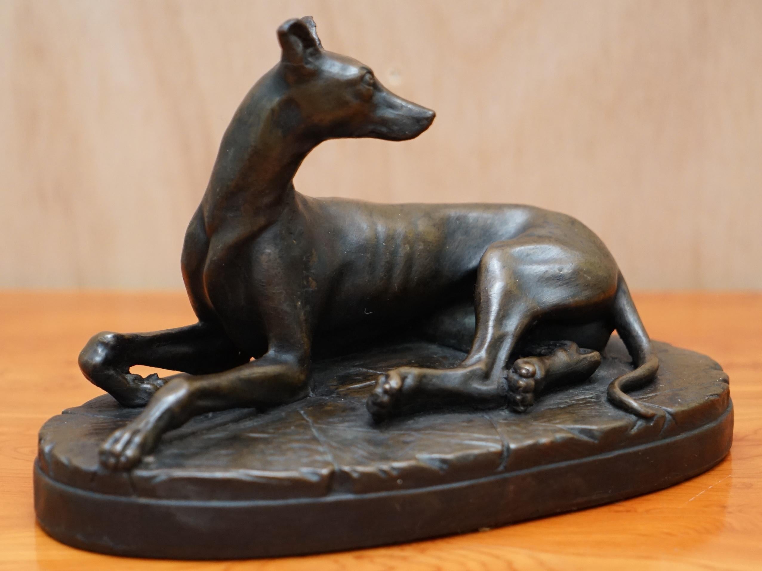 We are delighted to this lovely solid bronze statue of a Whippet dog laying down

A good looking and well made piece, very decorative, I have two of these the other is of a Mastiff which is listed under my other items

We have cleaned waxed and